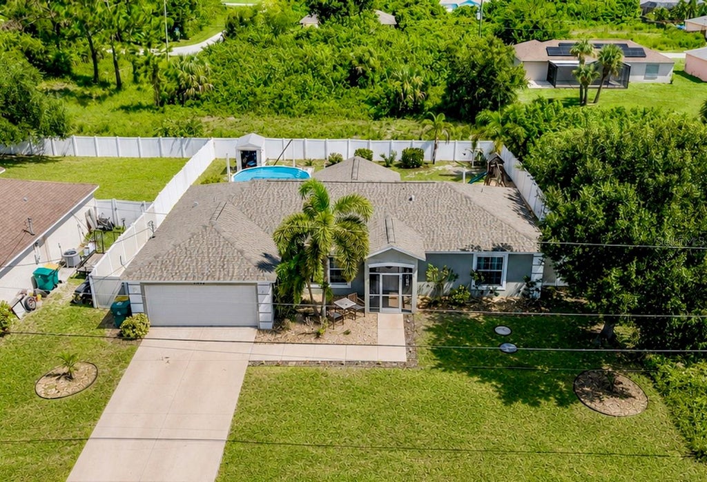 Photo of 12424 Birtle Avenue, Port Charlotte, FL 33981 (MLS # D6148444)