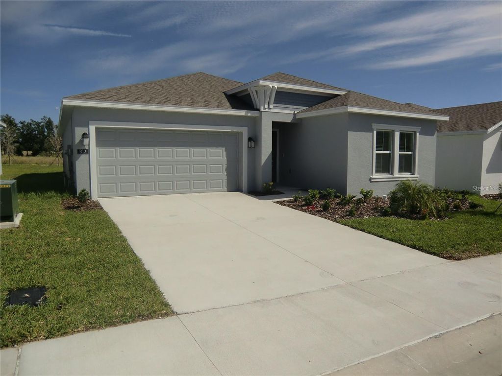Photo of 317 Loch Ct, Davenport, FL 33837 (MLS # O6363502)