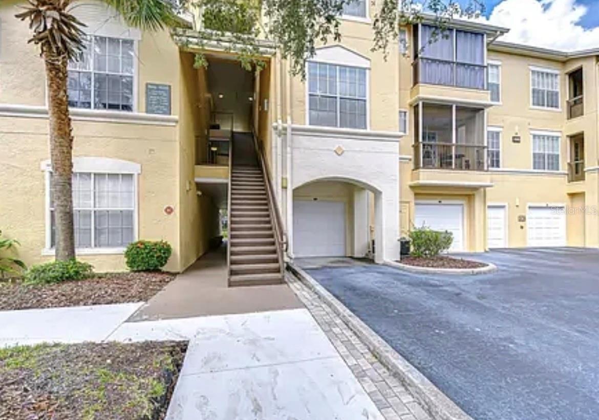 1st Floor condo with unattached one car GARAGE! WOOD-LOOK vinyl flooring throughout entire condo! Granite counter tops and solid wood cabinets in kitchen with glass top stove. Granite counter-tops and cabinets in both bathrooms. This is a beautiful 2 bedroom 2 bath condO. The Kitchen is open to the living room/dining area and features a breakfast bar and all appliances,inside laundry room with washer and dryer,split bedroom plan with two master bedrooms, ceiling fans, screened in patio and more with pond view. Located in a popular gated community with all the amenities that include resort style pool with sundeck and sauna, fitness center, elegant clubhouse that has separate lounge areas. The location of this condo is close to everything! Easy Access it I-75! Close to the Outlet mall, USF, Moffit, VA, lots of restaurants and shopping! This community offers a beautiful pool area, fitness center, playground and clubhouse! If that is not enough, you will also have membership to Club Tampa Palms which features: Heated family swimming pool with water slide, hot tub, playground, lobby with coffee bar,State of the Art fitness center,Men's and women's locker room with shower, media center with wide screen TV,play room,kitchen with ice machine, refrigerator and microwave,Two lighted tennis courts,basketball courts,gas and charcoal grills! All of this is only a half mile away from Oxford Place!