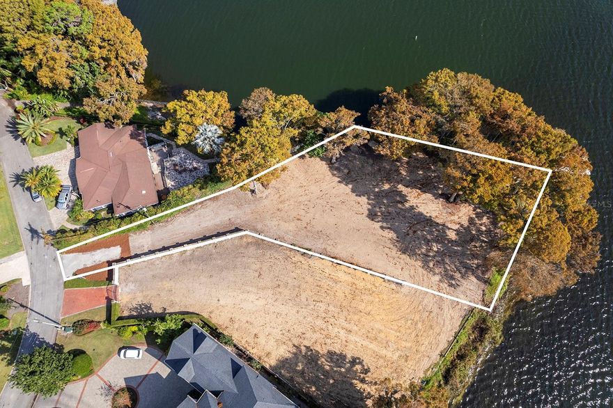 A rare opportunity to secure a Lake Maitland homesite on the desired Maitland–Winter Park Chain of Lakes, an increasingly limited offering as quality lakefront parcels continue to disappear. Along a quiet street with an exceptional sense of privacy, this property lends itself beautifully to a gated approach and captures expansive southern-facing water views, offering breathtaking light throughout the day, from early morning glow to sunset skies. With approximately 27,472 square feet of uplands, the site has been cleared and is poised for new construction. Preliminary estimates suggest the potential for a residence in the approximately 10,000-square-foot range (approximately 40% of the lot size), though all building parameters should be verified through the City of Maitland and your architect/builder during due diligence. Existing improvements include a seawall plus a covered boat lift and dock, delivering immediate enjoyment of the Chain-of-Lakes lifestyle with boating, fishing and watersports right from your backyard. Envision a multi-generational estate designed for life on the water including morning paddle rides, afternoons on the dock and evenings spent poolside watching boats drift by. From here, it’s easy to embrace the local lake culture, whether cruising across the water or heading into Winter Park for boutiques, dining and energy of Park Avenue, while enjoying convenient access to downtown Maitland amenities and major roadways. Additional opportunity of the neighboring lakefront parcel at 125 Whitecaps Circle (approximately 18,500 square feet/.42 acres) is also available, presenting an exceptional option to combine two side-by-side properties for a larger estate footprint or a shared family-and-friends compound. All measurements and development assumptions are provided as estimates and must be confirmed by appropriate governing authorities and your design/construction team.