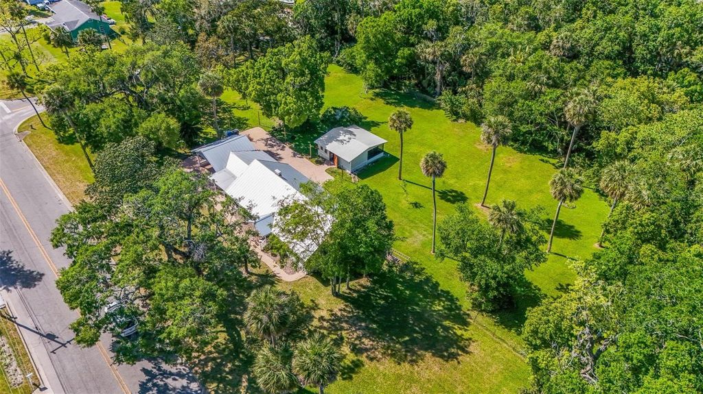 Photo of 1405 Pioneer Trail, New Smyrna Beach, FL 32168 (MLS # O6402846)