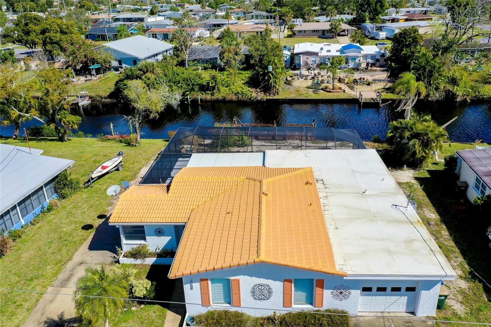 Waterfront Pool Home with Gulf Access in North Port
Welcome to your slice of paradise in beautiful North Port! This 3-bedroom, 2-bathroom pool home is perfectly positioned along a tranquil canal with direct access to the Myakka River and onward to the Gulf of Mexico.
Step inside to discover an inviting open-concept layout designed to maximize space and natural light. At the heart of the home, the sparkling pool takes center stage—visible from multiple living areas and creating a serene backdrop for both relaxation and entertaining. The desirable split floor plan ensures privacy, with a spacious owner’s suite that includes a versatile private area ideal for a home office, reading nook, or hobby space.
Outdoors, your personal waterfront retreat awaits. Enjoy the canal views from your private dock or set out on a leisurely boat ride to explore the region’s scenic waterways. The property also features a second driveway—perfect for storing a boat, RV, or additional vehicles.
Located just minutes from Downtown Wellen Park, Warm Mineral Springs, and an array of shopping and dining destinations, this home offers the perfect blend of peaceful waterfront living and everyday convenience.