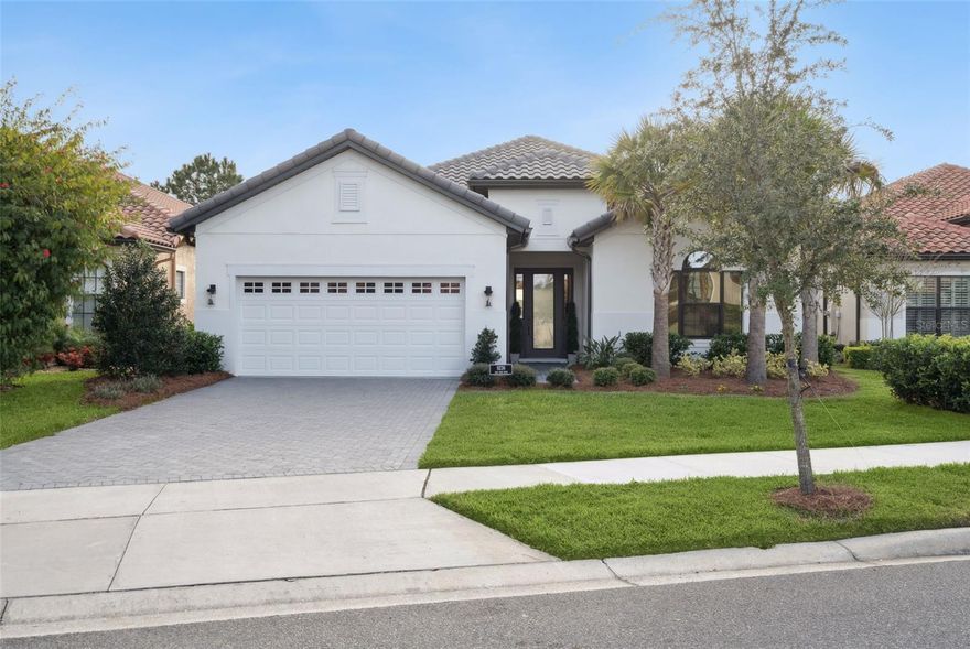 Welcome to 9236 San Jose Boulevard, a like-new home built in 2023 that perfectly blends luxury and functionality. This inviting residence features 3 bedrooms, 2 bathrooms, and 2,145 sq. ft. of living space in the desirable Las Colinas community at Mission Inn Resort. Step inside to discover an open floor plan elevated by soaring 12-foot ceilings and durable wood plank style tiling running throughout. Elegant crown molding accents the main living areas including the entryway, kitchen, and family room while custom roll-up shades on every window add a polished touch of privacy. The oversized 2-car garage, which comes finished with durable epoxy flooring and a dedicated 240V EV outlet also features ample storage. Outside, the covered and screened-in lanai provides a comfortable retreat overlooking a scenic naturescape, perfect for everyday comfort and entertaining alike. Enjoy Florida living in a peaceful setting with close proximity to world-class resort amenities. Mission Inn residents have access to an exceptional lifestyle, including two championship golf courses (El Campeón and Las Colinas), a resort-style pool, tennis, a fitness center, spa services, and multiple on-site dining options. Waterfront recreation is also nearby at the Mission Inn Marina on the Harris Chain of Lakes. Ideally located near shopping, dining, and the charming towns of Mount Dora, Tavares, and Clermont, this home offers the perfect balance of privacy and resort-style living. Please note that the HOA includes landscaping in the monthly fee. Membership to Mission Inn is required, with both Social and Golf options available.