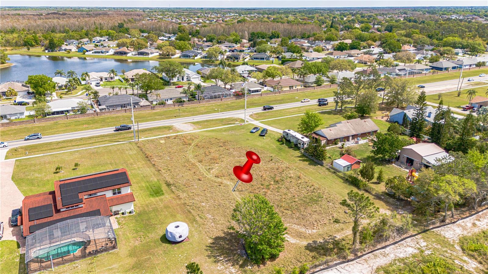0.88 +/- ACRES - BEAUTIFUL VACANT LOT - NO HOA - PICK YOUR OWN BUILDER or WE CAN PROVIDE A LIST. BUILD YOUR DREAM HOME OR PURCHASE FOR INVESTMENT. BUILD WHEN YOU ARE READY - NO TIMELINES. This property is conveniently located near the TURNPIKE exit 240.
