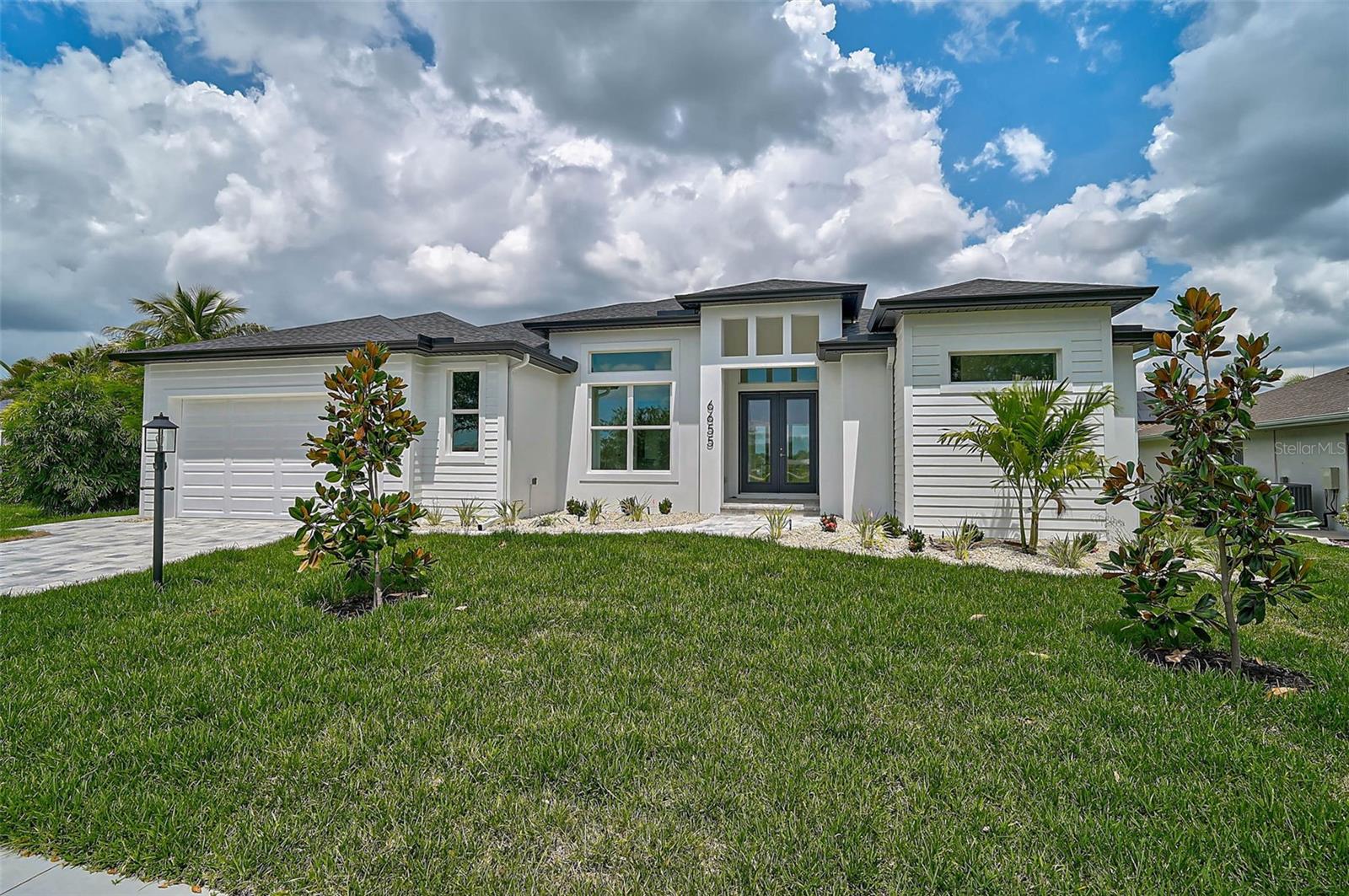 Discover this BEAUTIFULLY crafted, high quality waterfront home offering the perfect blend of luxury, comfort, and durability. With direct water access and dock-ready capability, this home is a boater's dream. Enjoy outdoor living at its finest with a sparkling pool, expansive paver lanai, and a fully landscaped yard featuring lush St. Augustine grass and a full irrigation system. Inside you'll find soaring high ceilings, tile flooring throughout, and energy efficient Low-E insulated impact windows and doors that fill the home with natural light. The spacious layout includes an office/den, an oversized garage, and a kitchen outfitted with solid stone countertops, soft-close Craftsman-style cabinetry, and premium finishes throughout. Built by a reputable local builder with attention to structural excellence, the home includes spray foam insulation, wire mat and fiber mesh reinforcement in the foundation, and is connected to city water and city sewer. This home offers the ideal Florida lifestyle-luxurious, efficient, and built to last!