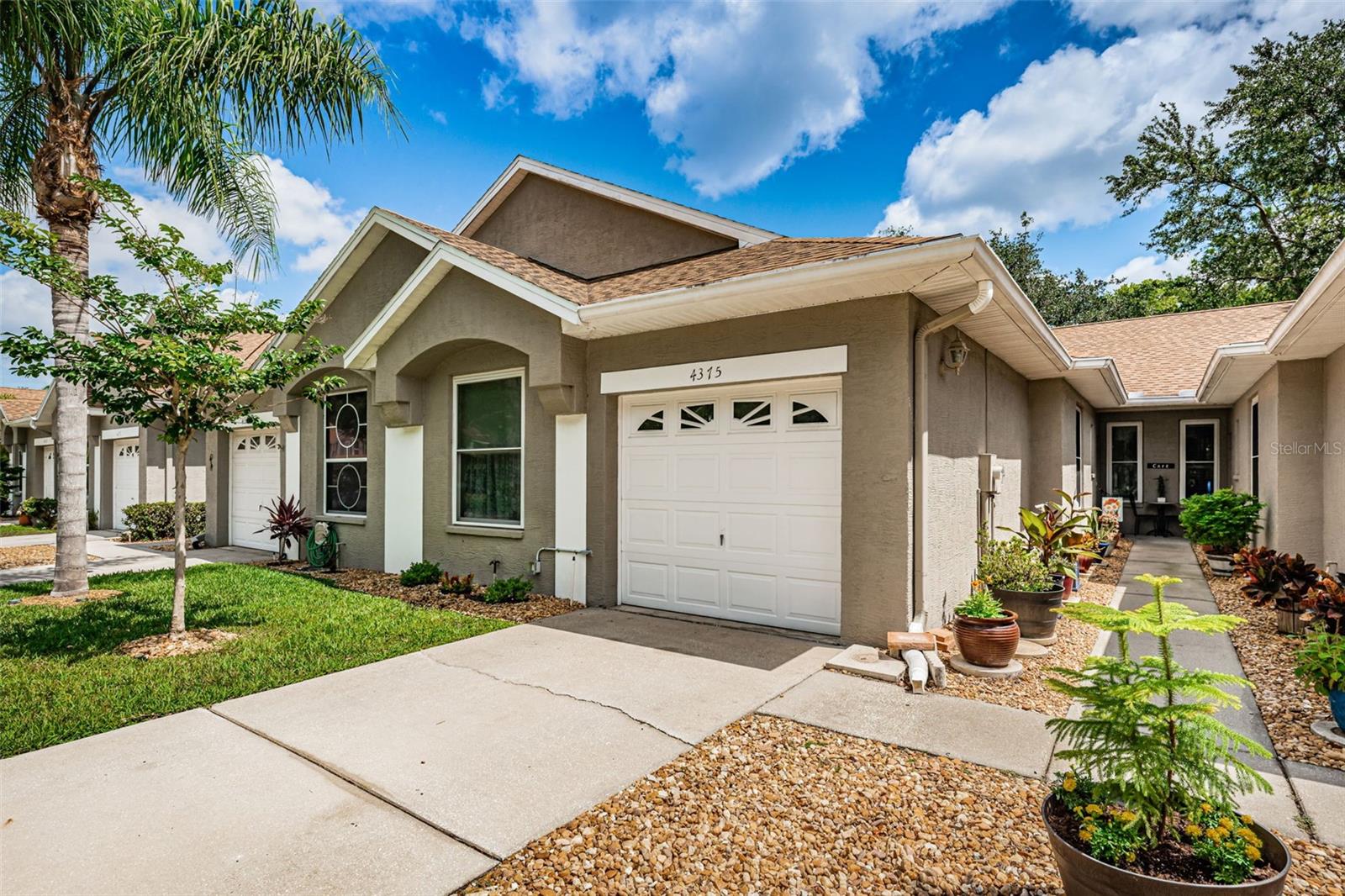 Nestled in nature is this upscale Brooker Creek East Lake Community: Updated two bedroom beauty. Wooded view with peaceful back yard creek; Large cozy Living Room. Neutral tones, ceiling fans throughout; Bright open, Kitchen with solid surface counters. Microwave and electric range 2021. Laundry with 2021 commercial washer/dryer.
Tile floors in Kitchen, Living Room, Dining Room Den, Master and Guest Bath. Master bedroom has walk in closet plus 2nd closet and all with closet systems. Master bath renovation; new floor in guest bath, screened water view lanai and extra patio on side of home; 2023 AC. Simonton Window Replacement, Additional Gutter Downspout. Plenty of storage; Walking distance to community pool, YMCA. DIRECT ACCESS TO THE BEAUTIFUL JOHN CHESTNUT PARK to enjoy nature trails, playgrounds, dog park and boat ramp; Close-by to shopping, banks, pharmacies, restaurants, golf, places of worship and more; Twenty minutes to Honeymoon Island State Park's refurbished powdery gulf beaches; Thirty minutes to Tampa International Airport and professional sports/cultural venues. Convenient access to top-rated schools: Cypress Woods Elementary, Carwise Middle School and East Lake High School. Gifted programs at Elisa Nelson Elementary and Dunedin Middle School; International Baccalaureate program at Palm Harbor University High School and East Lake Middle School Academy of Engineering. This home is a rare find and great value in a highly desirable community.