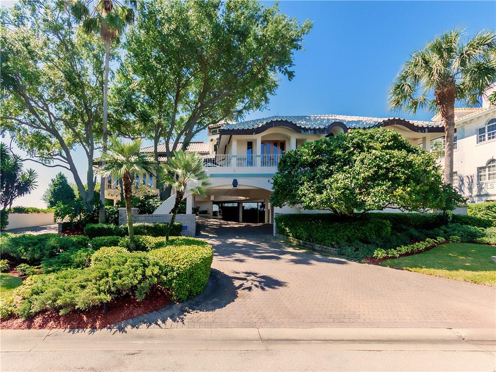 Unique home with meticulous attention to detail and quality, custom-designed amenities, commanding water views and breathtaking natural setting. Located in the desirable gated community of Bayway Isles, this 3-bedroom, 4-bath single family home was built in 1989. It offers 4,014 sq. ft. of living space and boasts a private pool with outside bath access, circular driveway, formal dining room, crown molding, skylights, elevator, wood-burning fireplace, master bath with bidet, dual sinks, 3-car garage with underground parking and much, much more. Enjoy lazy days and evening cocktails in this waterfront sanctuary. Easy access to water is a boater’s delight.