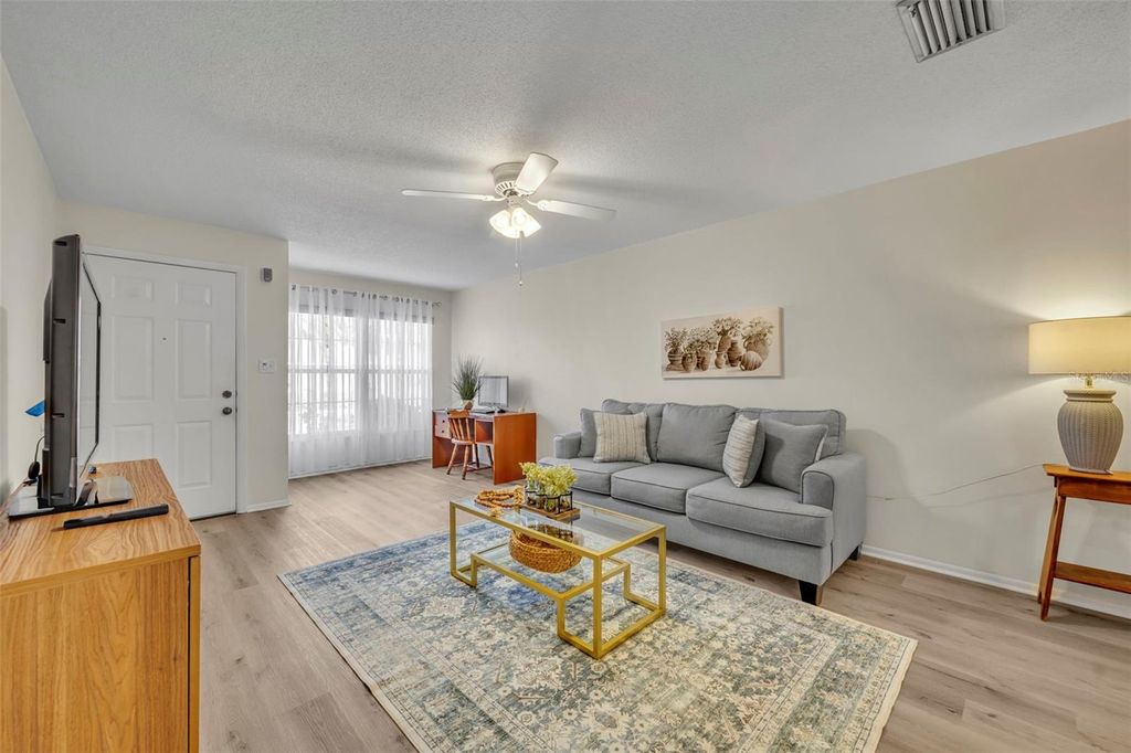 Photo of 221 Esplanade Way #105, Casselberry, FL 32707 (MLS # O6366657)