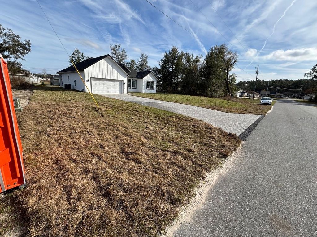 Photo of 7518 SW 128th Street, Ocala, FL 34473 (MLS # O6371570)