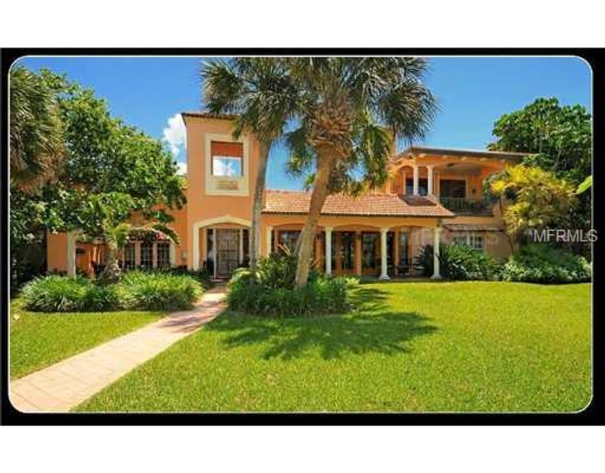 Beach and Bay Spanish Colonial Revival on almost an acre at the North end of Casey Key. Completely renovated in 2002 plus a 1350 sq ft 2nd story addition of a private master suite that includes his and her baths and a large dressing room closet. Views of the Gulf or Bay from every room and covered porches to enjoy Gulf breezes. Courtyards, bell towers, custom iron railings, wood beams, wood and Spanish tile floors and custom cabinetry exude charm. Bayside lap pool set in mature gardens overlooking wide bay and new dock. A private wide sandy walking beach completes this serene island home that offers privacy, comfort, and easy living. Room to add a guest house. Large Travertine Marble patio added in 2012  Exterior paint and 2 new HVOC's 2013.