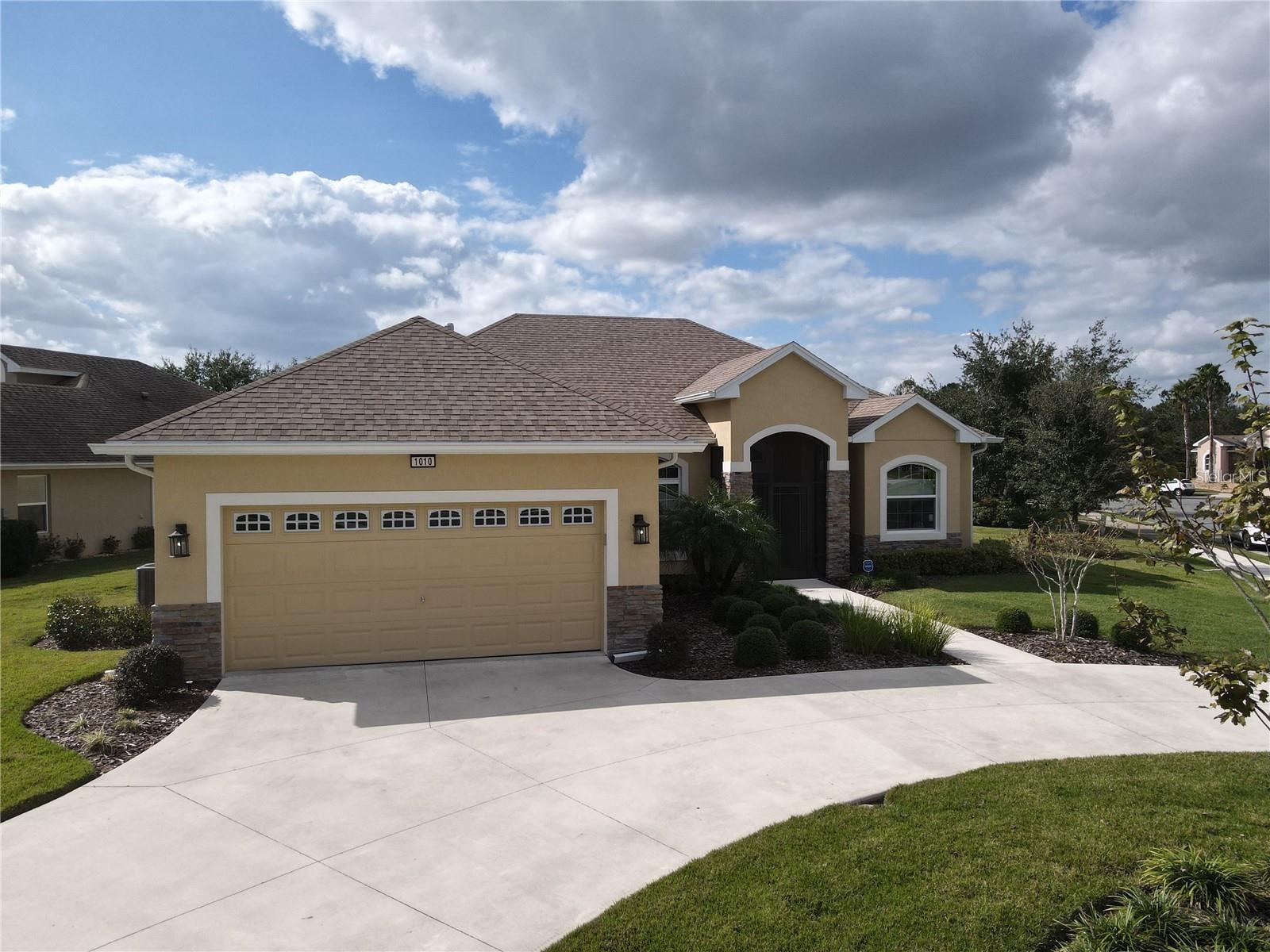 Live the Good Life in Lakes of Mount Dora! Just minutes from charming downtown Mount Dora, this beautifully appointed home is nestled on a meticulously manicured lot that’s sure to impress with a peekabo waterview. This vibrant 55+ active community home offers resort-style living with amenities including pickleball, tennis, shuffleboard, swimming, corn hole, a fitness center, and even RV/boat parking. Inside, you'll find custom finishes and high-end appliances in a kitchen designed for both everyday living and entertaining. Choose from bar seating, a cozy dinette, or a formal dining room, and enjoy the convenience of two pantries to store all your culinary essentials. The luxurious owner's suite features three spacious closets, a spa-like ensuite with a soaking tub and walk-in shower—your personal retreat at the end of each day. Two additional guest bedrooms and a full bath are located on the opposite side of the home, offering privacy and comfort for visitors. Additional premium features include: Generac whole-home generator, tankless water heater, gas range, dryer, and heating, blown-in wall insulation, Termite bond, water filtration system, and security system. Don't miss your chance to own this exceptional home in one of Central Florida's most desirable 55+ communities. Schedule your private showing today and experience the lifestyle you deserve!