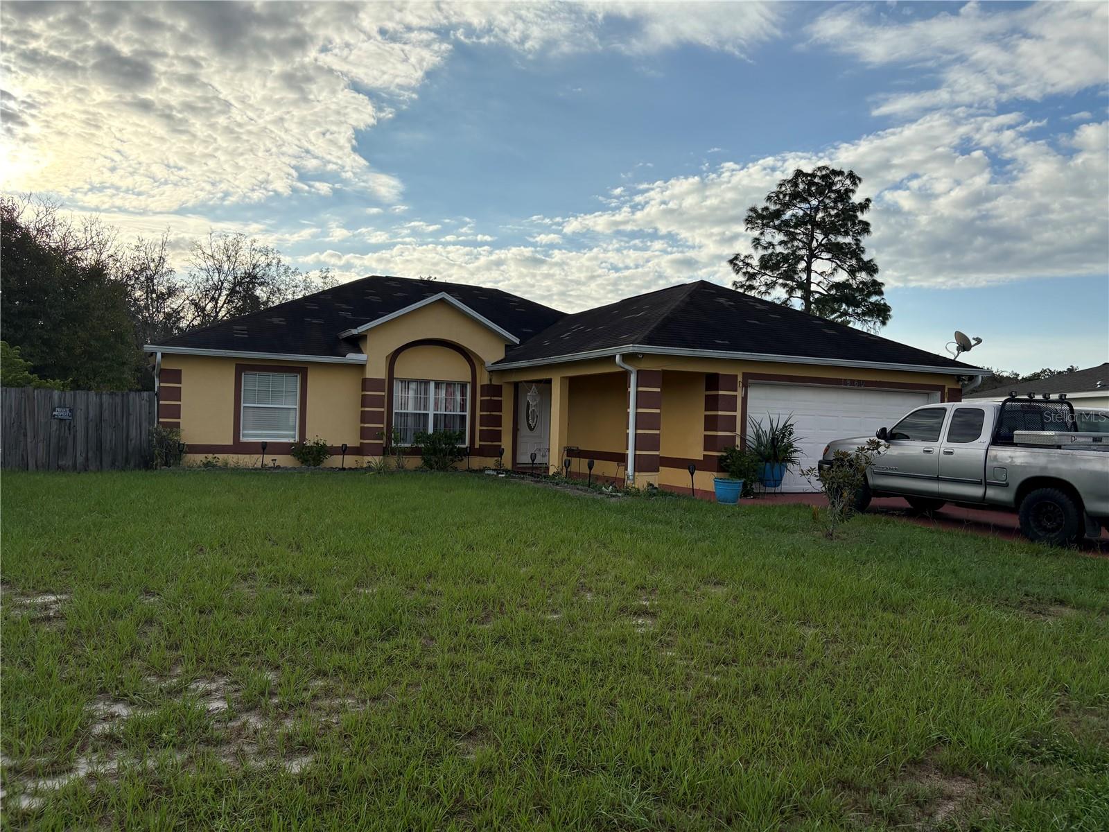 Investor special. Fantastic 4-Bedroom Single-Family Home with Ample Parking & Outdoor Space 4 bedrooms | 2 bathrooms | 2 two-car garages (space for four cars total) Open-concept kitchen flowing into dining & living areas. Private primary suite with walk-in closet, dual sinks & walk-in shower. Separate wing with three bedrooms & full guest bath – perfect for family, guests, or office. Spacious fenced backyard with large patio – ideal for entertaining & relaxation. This home offers the perfect blend of space, style, and functionality both inside and out!