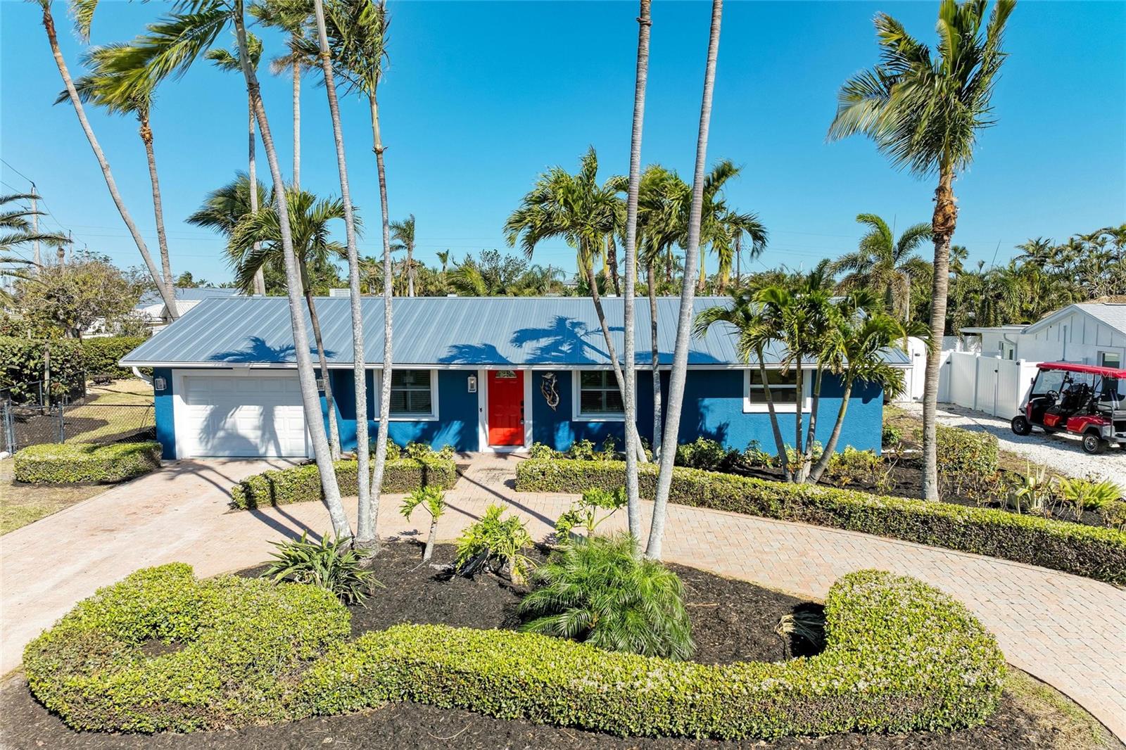 One or more photo(s) has been virtually staged. Welcome to your dream coastal retreat! DEEDED BOAT SLIP included. Nestled in the heart of Holmes Beach on a generous corner lot, this beautifully remodeled 2-bedroom, 2-bathroom pool home with a new roof offers the perfect blend of modern luxury and laid-back island living. Step inside to find a stunning top-to-bottom renovation, featuring elegant finishes, shiplap walls, plantation shutters, an open-concept design and a cedar planked patio with abundant natural light. The gourmet kitchen boasts high-end appliances and custom cabinetry, ideal for entertaining or relaxing after a day on the water. This home also has a new AC unit and a new garage door, cabinets and epoxy flooring. Take a dip in the sparkling waterfall pool or lounge on the sun-soaked patio. Whether you're a beach lover or simply seeking the perfect getaway, this home has it all and is perfect for a seasonal or full time resident. Located just moments from the pristine Anna Maria Island beaches, local dining and island attractions, this is your opportunity to own a slice of paradise and be just a short stroll to all the delights of Anna Maria Island. Rentals are permitted. Schedule your private tour today!