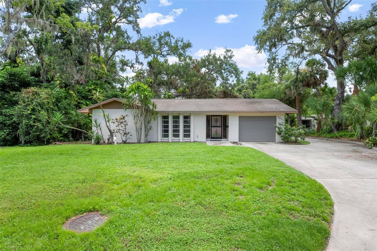 Welcome to Nature's Paradise! This charming home is nestled in a quiet and friendly neighborhood offering a serene retreat like feel. This is a 2 bedroom 2 bath split plan home which also boasts an amazing spacious bonus room that can be made into anything your heart desires- an office, she-shed, man cave, art room, playroom, gym, or work area are just a few examples for this great space. In addition, this home is NOT deed restricted and has ample space for any type of storage, even an RV or camper. The home has a big lanai, as well as a fenced backed yard for your furry friend. This property is a nature enthusiast's dream. It is filled with beautiful mature trees and birds along with a walkway to the creek nestled in. All of this, plus this home is centrally located to all of what Sarasota has to offer- restaurants, shopping, great schools and a short 10-15 minute drive to the world famous Siesta Beach. Don't miss out on seeing this one of a kind gem!! Schedule your private showing today.