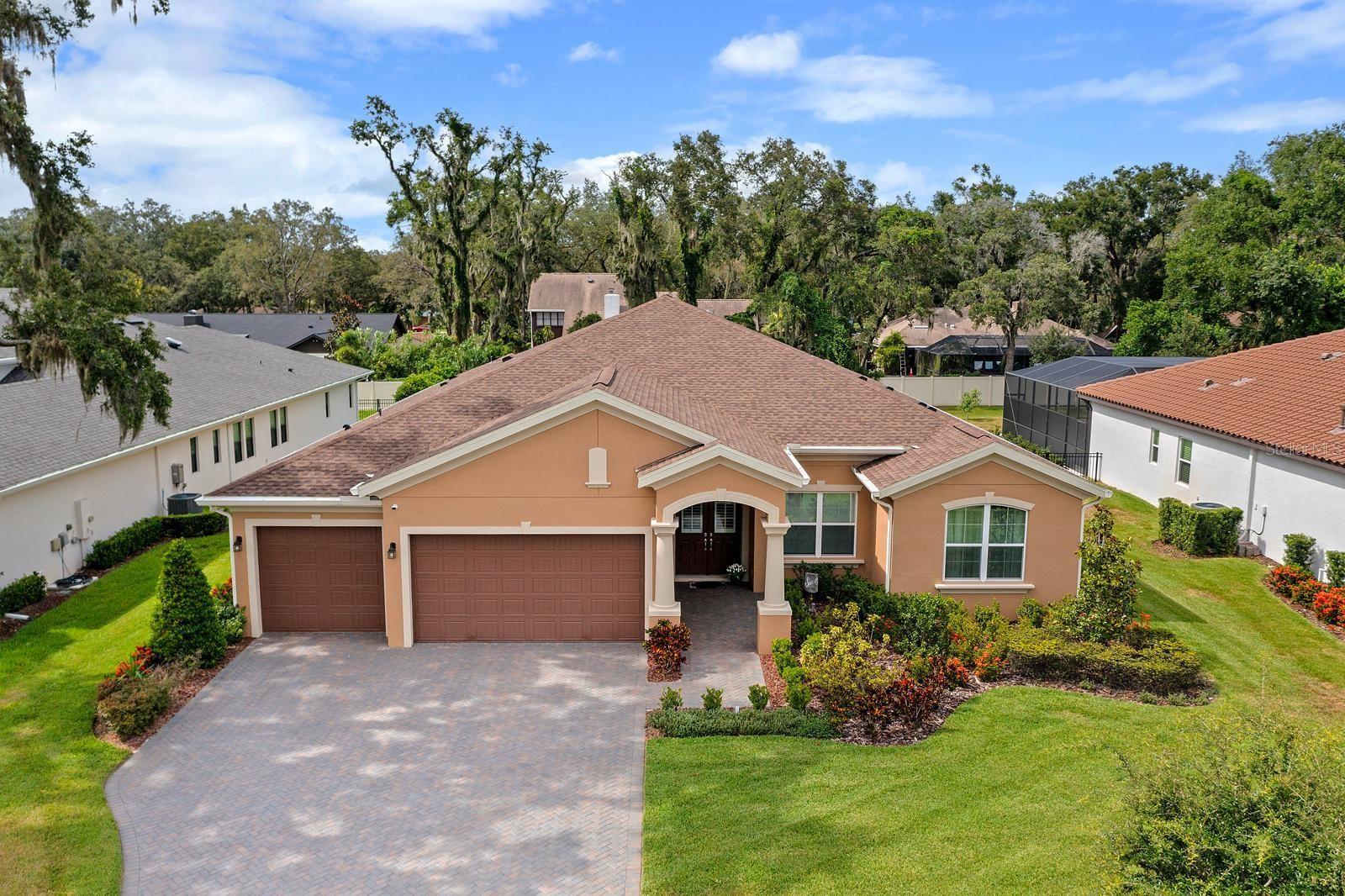 Magnificent 2022 custom-built home, located in the Exclusive, Gated Neighborhood Hidden Reserve in Brandon, Florida, just minutes from Tampa. This 4-bed, 4-bath beauty built by Sabal Homes is the epitome of sophistication blended with contemporary comfort and luxury. The unique, 4-way-split floor plan ensures each bedroom has its own full bathroom AND walk-in closet, and the spacious Great Room and Kitchen are extremely spacious and perfect for entertaining. The huge Bonus Room is tucked away in the back of the home and provides a separate space for games, theatre, crafts, or even a separate living space for an in-law suite. As you enter the front foyer, there is an Office with FRENCH DOORS to your right, and straight ahead through the TRIPLE sliding doors, is a glorious view of the luxurious POOL & SPA! You’ll appreciate the extra finishes that this home boasts....high-end LVP flooring throughout the main living areas and bedrooms, 10' ceilings, 8’ tall doors everywhere, 5-1/4" baseboards, and lighted ceiling fans with remotes in every room. The expansive Chef’s Kitchen features everything you’d expect in a luxury home...stylish QUARTZ countertops in kitchen and all bathrooms, a plethora of creamy custom 42” cabinets with soft-close, underlighting and crown molding, sleek STAINLESS appliances with a gas stove top and stylish RANGE HOOD, a large WALK-IN PANTRY with a SECOND FRIDGE, and a dining area overlooking the pool and lanai. Retreat to the lavish Primary Suite where your private SPA-LIKE ensuite awaits. Enjoy a double-sink vanity with ample storage under the long, sleek QUARTZ COUNTERTOPS, an extra-long walk-in shower with DUAL SHOWER HEADS, a modern stand-alone SOAKING TUB, large linen closet, and a spacious water closet with a privacy window. The Primary Suite also features TWO LARGE WALK-IN CLOSETS and plenty of room for a king-size bed as well as a sitting area to lounge and relax. Out back, the expansive, covered lanai overlooks the custom-designed saltwater pool with a sunshelf and a jacuzzi spa. ADDITIONAL UPGRADES & FEATURES include: All Ecobee security cameras, equipment, thermostat, and Ring Doorbell will convey; NATURAL GAS for your appliances, pool and gas grill; water softener & carbon purification system; R/O for under the sink and fridge water; spacious Laundry Room with cabinets, storage shelves, and a vanity utility sink; TANKLESS hot water heater; Great Room tray ceiling; LED lighting throughout the home and in the pool; pebble-tec saltwater pool; pool safety fence; floor outlets in the Great Room and Office; and a PAVERED driveway for the 3-CAR GARAGE. This METICULOUSLY clean home feels brand new, and with all the high-end finishes and unique floor plan, you’ll enjoy the perfect blend of privacy, style, and functionality! 10 minutes to I-75 and the Crosstown....30-40 minutes to Downtown Tampa and Tampa Int’l Airport, and very convenient to dozens of restaurants, shops, Walmart, Home Depot, Publix, Downtown Brandon, and much more!
