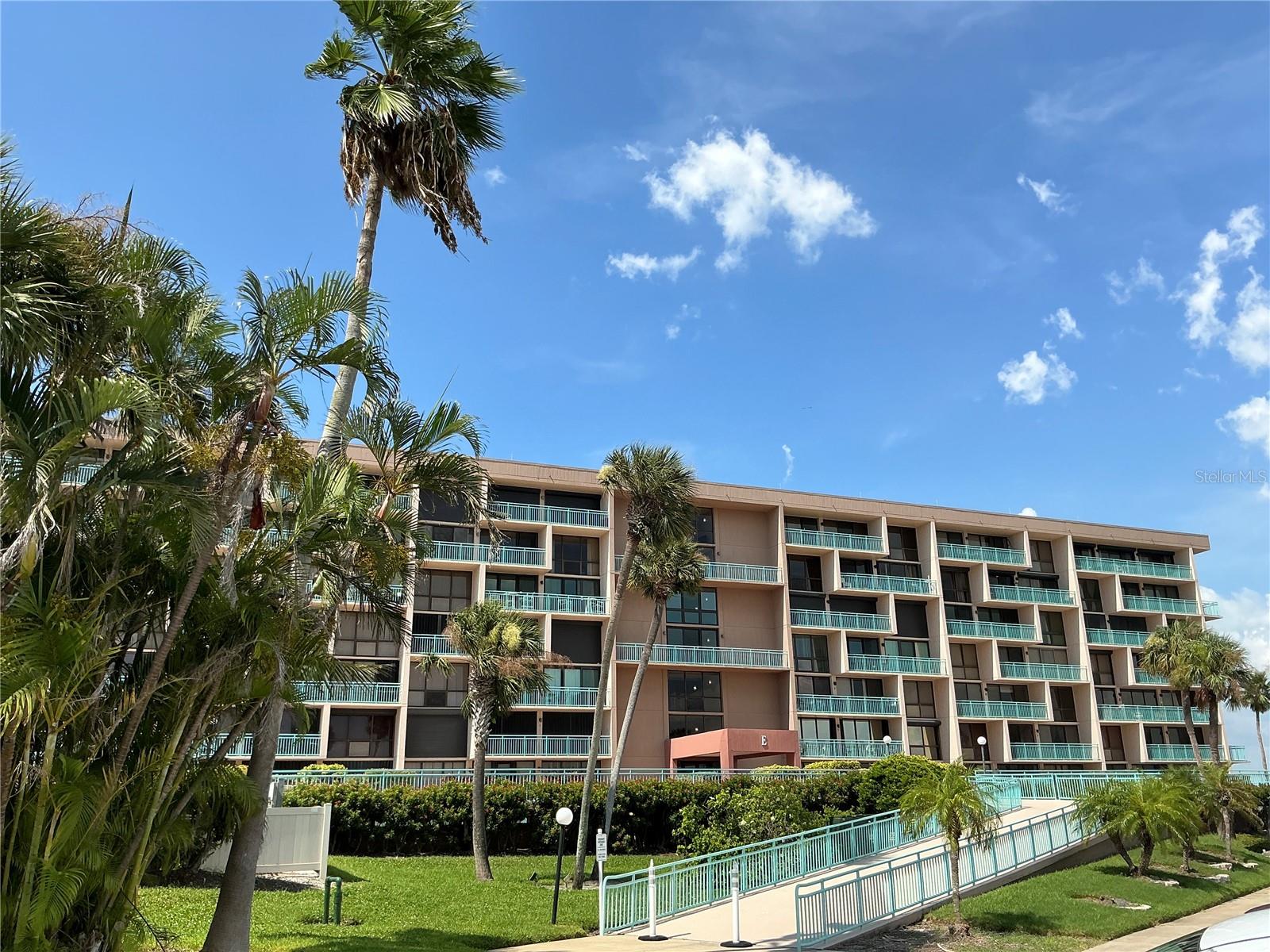 One or more photos has been virtually staged. Live the waterfront lifestyle at 1 Key Capri! Welcome to Unit 213 E-a beautifully updated condo in a gated resort style community on Treasure Island. Boating enthusiasts take note, boat slips are available for lease at just five dollars a foot and includes water and electric. Whether you are boating, paddle boarding, fishing or kayaking, you can do it all right from your backyard. This spacious 3 bedroom 2.5 bath unit features, modern upgrades, open kitchen with open water views, abundant natural light, and three private balconies perfect for enjoying the Florida sunshine and fresh air. Dine alfresco on your balcony as you watch pirate ships sail past, dolphins swim and enjoy the lively views of John’s Pass Boardwalk. Step inside and find new tile floors, open concept living and dining area and remodeled kitchen with stainless steel appliances. Primary suite is spacious and includes an en-suite bath, walk-in closet and 3 private balconies. One of the guest bedrooms opens to a private balcony with serene views. Community amenities include a geothermal heated pool, hot tub, tennis courts, a fishing pier, putting green, tiki hut with tv, fitness center, sauna, a social room, Billiards, 2 libraries, covered parking and additional storage. Enjoy sunsets, Gulf breezes with an unbeatable Florida lifestyle. The condo is walking distance to the beach, shops, dining, and pickleball courts. Live every day like you’re on vacation at Key Capri Condos, a rare find on Treasure Island.