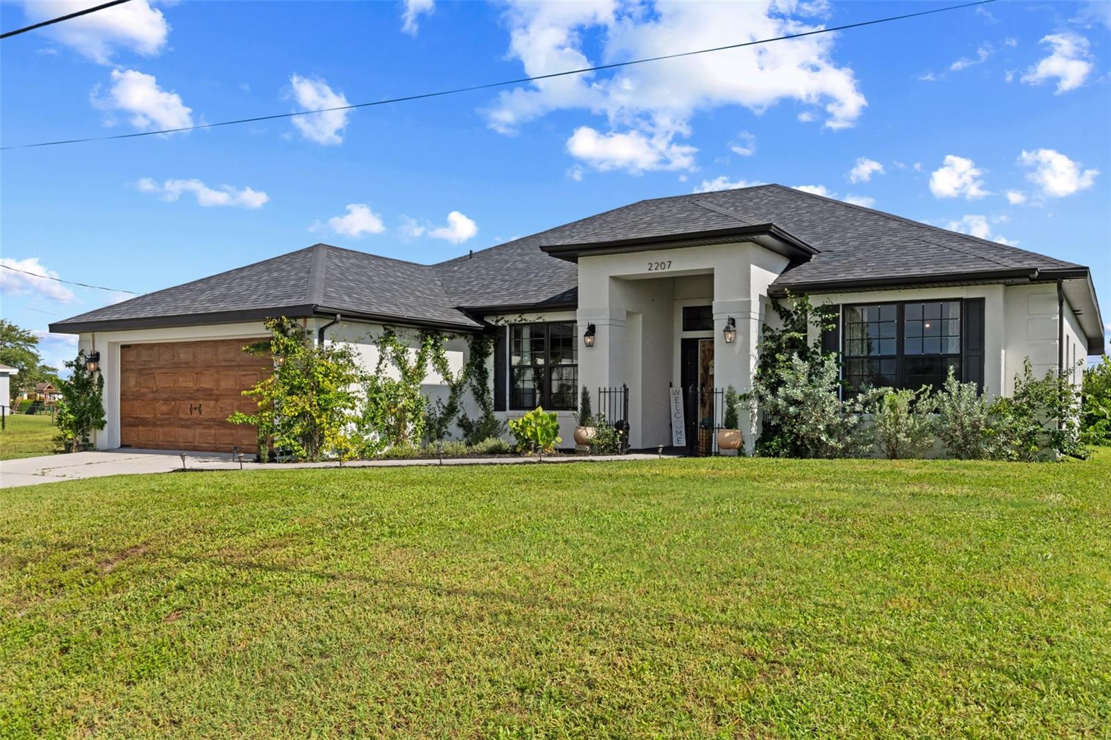 * * * ASSUMABLE 3.25% MORTGAGE!!! * * * Prepare to be impressed by this beautifully upgraded 4 bedroom, 2 bathroom home that blends modern design, functional living, and incredible outdoor space, all with no HOA. Thoughtfully updated from top to bottom, this move-in ready home is packed with upgrades that make everyday living effortless. Enjoy the confidence of a brand new roof with Owens Corning shingles (30-year warranty), a new well system, a new water heater, and fresh interior and exterior paint. Inside, luxury vinyl plank flooring runs throughout the home, complemented by custom Synergy accent walls, new lighting, ceiling fans, and a convenient keypad entry lock. The open-concept layout offers a spacious main living area with a built-in fireplace, perfect for both relaxing and entertaining. The kitchen features ample storage, generous counter space, a breakfast bar, and a bright breakfast nook. A formal dining room adds extra space for hosting, while the front bonus room is ideal as a home office, reading area, or playroom. The split bedroom layout enhances privacy, with the primary suite offering direct access to a screened sunroom where you can unwind and enjoy the outdoors in comfort. Three additional bedrooms share a full bathroom and provide flexibility for guests or everyday living. Outside, the fully fenced backyard is designed for enjoyment with beautiful landscaping, a spacious rear patio, and a fire pit area that's perfect for gathering with friends or relaxing under the stars. With extensive upgrades, custom touches, and a layout that fits a variety of lifestyles, this home truly stands out. Schedule your private showing today!