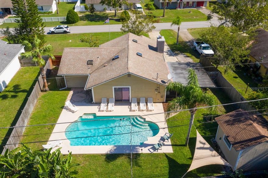 Seller says SELL!!   Quiet, comfortable Country living in the City. Vaulted ceiling with beams in living room along with fireplace, makes for a relaxing setting. Open kitchen with dining area. Screened patio just steps to pool with a 20'x 30' deck area. Pool pump and motor replaced in 2019. Both bathroom showers have been redone.
New electric panel box, 2019.  A/C installed 2016. There is a shed in the back yard for additional storage.
All flooring is new tile, new throughout, except for the kitchen.
This home has been well maintained and pride of ownership shows. ;Water: City