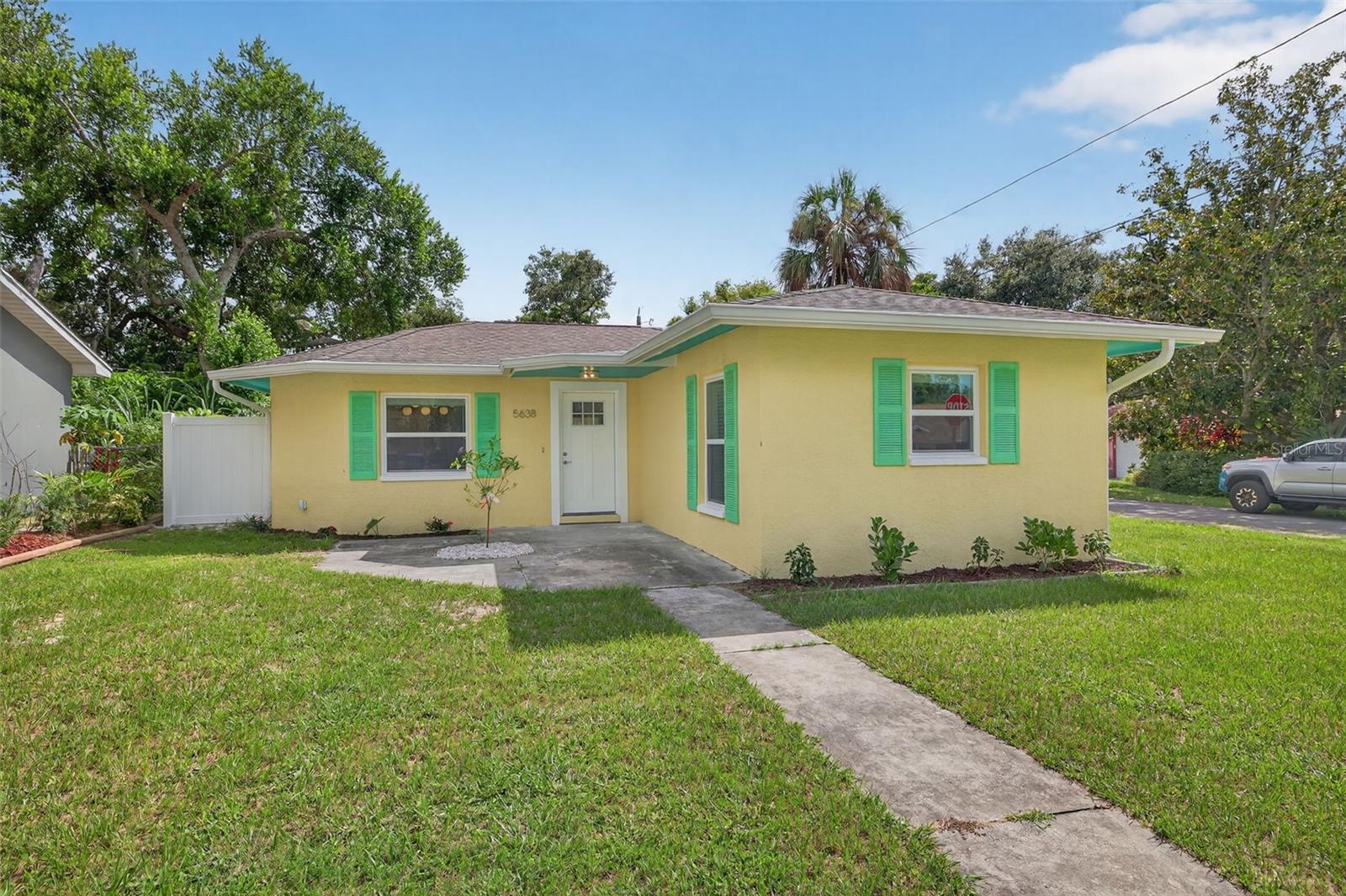 One or more photo(s) has been virtually staged. Come see this beautiful, luxuriously renovated home just blocks from all the action and restaurants on Main Street, Sims Park, and the new aquatic center in downtown New Port Richey! The home has had EVERYTHING updated while still keeping its vintage charm, with an authentic Florida flair!
The property is not in a flood zone, and didn't have any damage from either of the storms last year.
The home has an open, split floorplan with 3 spacious bedrooms and 2 full bathrooms, with the primary suite located in the back of the house for extra privacy. Off the kitchen, is a mud room/bonus space with a laundry closet, extra storage, and room for a desk/office space as well.
Inside, the home has a brand new hvac system, new electrical including panel, and was replumbed. In addition, it has new solid wood cabinets and vanities, quartz countertops, SS appliances, custom tiled backsplash, solid wood interior doors with crystal glass doorknobs, and MCM lighting and plumbing fixtures. The floors have new lvp, with tile in the bathrooms and kitchen. Both bathrooms were gutted and redone with custom tile and finishes.
On the outside, the home has a new roof, new windows, front and side doors, the exterior completely restuccoed and painted to match the downtown New Port Richey vibe! Also a new white vinyl fence enclosing the expansive backyard, large enough to add a pool, or even an adu or detached garage with alley access in the back. The backyard currently had a large shed for extra storage. A spacious, enclosed Florida room was added to enjoy the best of indoor/outdoor living!
Don't wait to view this fabulous home, in a can't be beat location, that will meet and exceed your expectations!