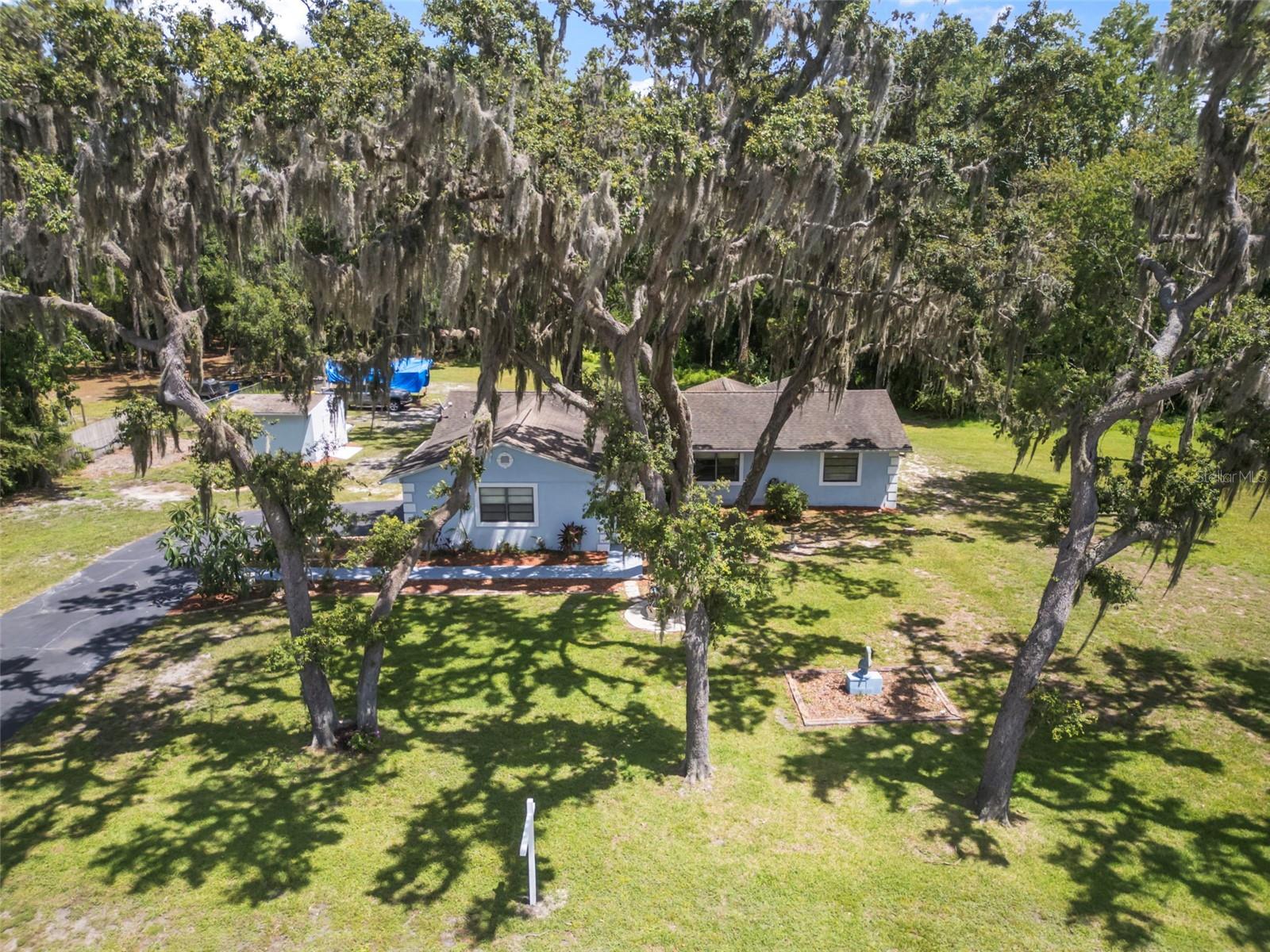 Just under 1 acre on a fully usable conservation lot with NO CDD and NO HOA! Enjoy the freedom and space to park your boats, trailers, or even build your dream shop. This beautifully updated home features a new A/C unit, new water heater, and water softener for added comfort and peace of mind. The spacious screened-in lanai is perfect for relaxing and enjoying serene views of local wildlife. Conveniently located just 35 minutes from Tampa International Airport and only 15 minutes from the Hudson Beach boat launch. Call today!