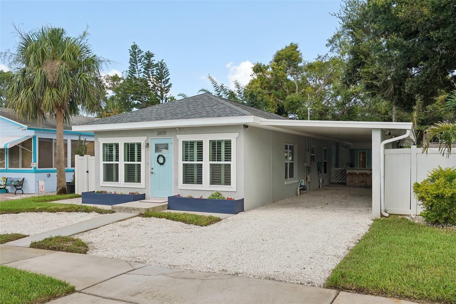 This beautifully updated 3-bedroom, 2-bath Gulfport home was completely renovated in 2018—so there’s no “fixing up” required. Upgrades include hurricane-rated windows and doors, spa-inspired bathrooms, soft-close solid wood cabinetry, granite countertops, water-resistant laminate flooring, LED electric fireplace, and California Closets. Major improvements feature a new HVAC system and ductwork, new roof with hurricane clips, all-new electrical wiring and panel, new plumbing to the main sewer, and a new carport.
The backyard is a true Florida oasis, complete with a gorgeous outdoor kitchen, spacious covered lanai that feels like an outdoor living room, a fire pit, and lush tropical landscaping—perfect for entertaining or relaxing in privacy. Whether hosting friends for sunset cocktails or enjoying a quiet morning coffee, this outdoor space is designed for year-round enjoyment.
Located just one block from the marina and minutes from Gulfport’s charming Waterfront District with its restaurants, shops, art studios, and year-round festivals, this home offers the best of Gulfport living.