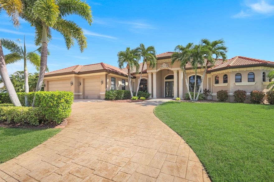 A Classic Beauty in SW Cape Coral!
This custom-built Aubuchon Gulf-access home offers timeless elegance and exceptional craftsmanship on a spacious .42-acre lot with 130 feet of waterfront. Boating enthusiasts will love the composite dock and 14,000 lb. lift, providing easy access to the Gulf.
Step through the etched glass double doors and be welcomed by an open, light-filled living space with a wall of sliding glass doors showcasing stunning views of the pool and canal. The 2,800 sq. ft. floor plan includes 4 bedrooms plus a den (or 5th bedroom) and 3 full baths, designed for both comfort and entertaining.
The Chef’s kitchen features double ovens, a cooktop, a walk-in pantry, and a breakfast bar that opens to the family room, overlooking the lanai and pool area. Elegant tray ceilings, and architectural details elevate the home’s interior appeal.
The spacious primary suite offers a private retreat with French doors to the pool, abundant natural light, and a luxurious ensuite bath featuring a soaking tub, a large walk-through shower, dual vanities, and two walk-in closets.
Enjoy outdoor living at its finest on the expansive screened lanai, perfect for entertaining or relaxing by the sparkling pool, all while taking in beautiful waterfront views.
Electric roll-down shutters protect the lanai, while accordion shutters safeguard the windows—providing peace of mind and storm security. And No Flooding from any of the storms.