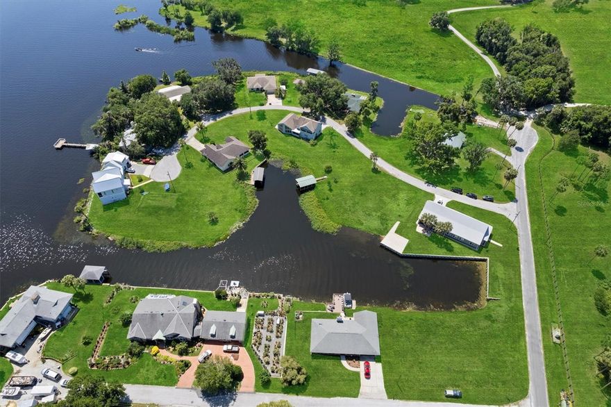 One or more photo(s) has been virtually staged. Brand New, One-of-a-Kind Lakefront Home in Orange Lake Shores!

Welcome to the newest and most exceptional home to hit Orange Lake Shores in years — a custom-built lakefront masterpiece where luxury, durability, and thoughtful design come together. With breathtaking water views and direct lake access, this home is perfect for full-time living or a seasonal escape.

Built with 11-inch-thick insulated concrete form walls rated for 140+ mph winds, James Hardie board siding, and elevated safely above FEMA's 100-year flood line, this home is made to last. Inside, enjoy 11-foot ceilings, smart home features with USB outlets in every room, and a 400 AMP electrical service with generator hookups and RV connection.

The home includes a standard, easy-maintenance septic system, engineered HVAC with dehumidifier, two tankless water heaters, and a top of the line water filtration system. An ADT security system (owner-owned) is ready for transfer.

Entertain in style with a custom kitchen and wet bar featuring granite countertops, a KitchenAid wine cooler, and pass-through to the living area. There are seven sinks, plantation shutters on all windows, and built-in features throughout. The oversized laundry room, butler’s pantry, and abundant cabinet space add functionality and flair.

Each bedroom offers built-in granite counters and storage. The property also features outdoor hot/cold shower, underground drainage, fresh sod, and multiple refrigerator hookups — including one in the shop for an ice machine.

Located just minutes from Gainesville, Ocala, and Florida’s natural attractions, this is more than a home — it's a rare opportunity to own a lakefront dream unlike anything else on the market.