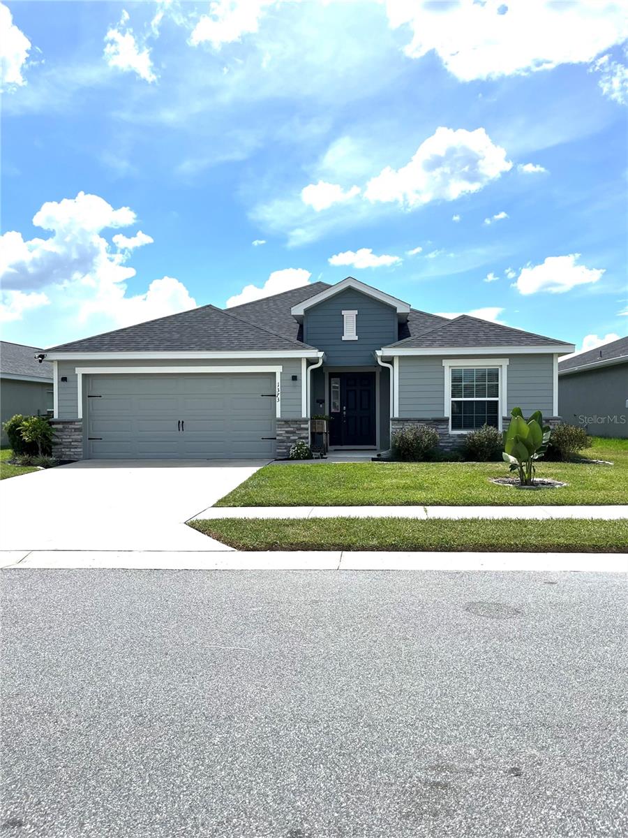 This beautifully built 2023 Highland Homes residence is a 3-bedroom, 2-bathroom property located in The Enclave at Lake Myrtle community in Auburndale, Florida. It features a versatile bonus/flex room ideal for an office, playroom, or entertainment space, alongside an open floor plan that seamlessly combines the kitchen, living, and dining areas. The spacious kitchen boasts a large island with granite countertops, built in sink/dishwasher and a massive pantry, complemented by in-house laundry facilities. The fenced yard and thoughtfully designed garden add outdoor appeal, while the inclusion of gym equipment and or other furniture with purchase enhances convenience. The home's great location makes it a desirable choice for comfortable, florida living.
The plant list includes the following:
- Meyer Lemon Tree
- 2 legacy blueberry bushes
- 2 Thornless blackberry bushes
- Valencia orange tree
- Thai banana tree
- butterfly garden
- 2 Roma tomato plant
- Serrano pepper plant
