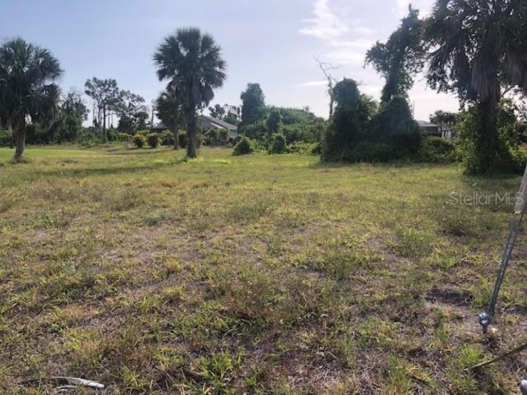 Photo of 833 Boundary Boulevard, Rotonda West, FL 33947 (MLS # D6136304)