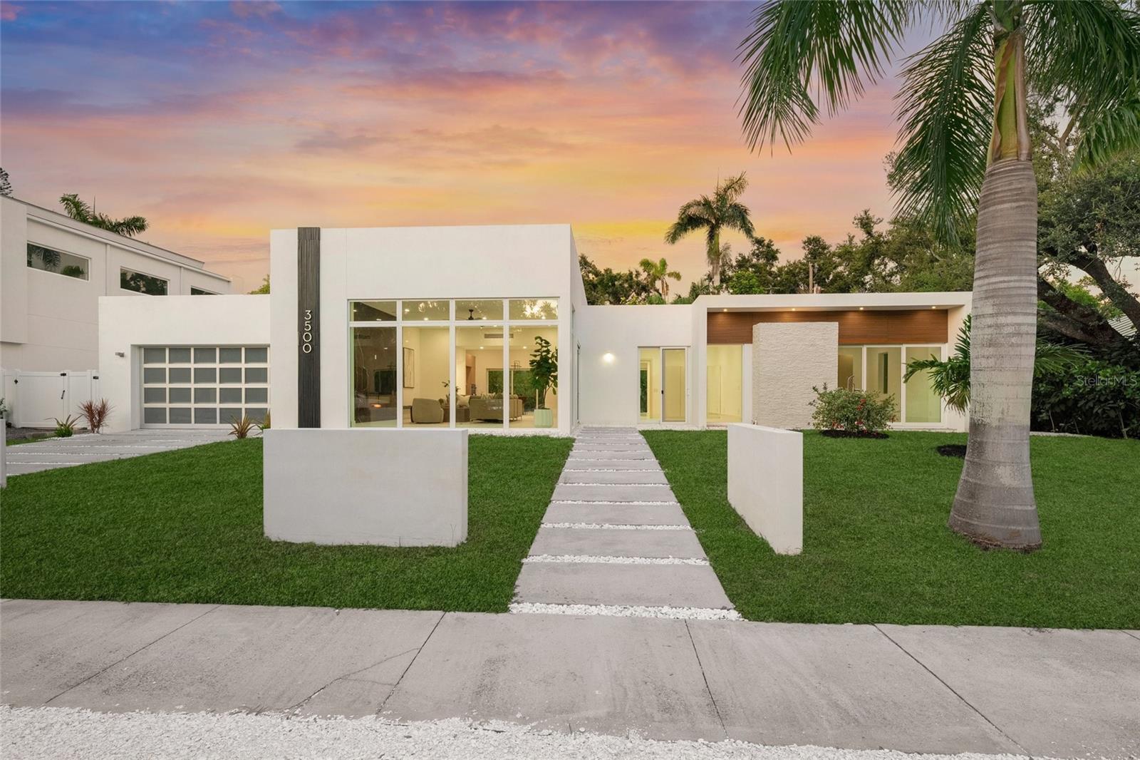 Introducing 3500 Bay Shore Road, This home took on a complete transformation.. completely redesigned and renovated in June 2025, this modern masterpiece situated in one of Sarasota's most coveted neighborhoods. Meticulously redesigned, this luxurious residence offers an impeccable blend of elegance, refinement, and contemporary design. The gourmet kitchen is adorned with striking brand new white oak cabinetry imported directly from Europe, harmoniously complemented by new Taj Mahal quartzite countertops, creating an ambiance of understated luxury perfect for culinary artistry and entertainment.
Step into the expansive, sunlit living area featuring new grand windows, soaring ceilings, and an extraordinary 12-foot fireplace wall, exuding warmth and grandeur. The impressive primary suite is an elegant retreat complete with bespoke custom closets and direct access to the serene pool terrace. Relaxation awaits in the opulent spa-inspired bathroom featuring sleek, modern fixtures and elegant design details worthy of a high-end resort.
Every inch of this home boasts premium finishes, from the generously proportioned tile flooring to the convenience of hurricane impact windows, central vacuum system, and Tesla charging station in the garage. Outdoors, experience refined Florida living with a pristine lap pool flanked by lush tropical landscaping and a stylish cabana—ideal for entertaining guests or indulging in quiet relaxation. This property is NOT in a Flood zone.
Perfectly positioned within minutes of Sarasota’s vibrant downtown, this home offers easy access to world-renowned beaches such as Lido Key and Siesta Key, premier shopping destinations including St. Armands Circle, and cultural gems like the Ringling Museum and Sarasota Opera House. Surrounded by upscale dining, local parks, and yacht clubs, 3500 Bay Shore Road delivers the ultimate combination of modern luxury and sophisticated coastal living.