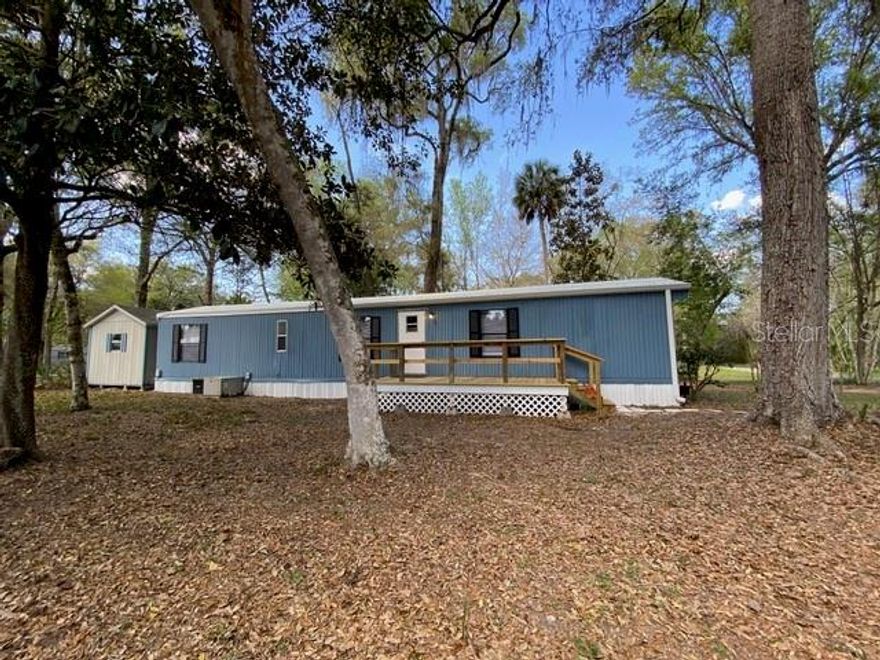 Clean and neat as a pin! Check out this hard to find, immaculate and affordable home on 1/4 acre. No Lot Rent! Country atmosphere just minutes from downtown Ocala, shopping, dining, medical, etc. Enjoy a secluded, private community, without the expense! Recent updates include brand new roof, flooring, refrigerator, bathroom vanities, shower doors, lighting, blinds, and freshly painted. Move in ready and priced right!!