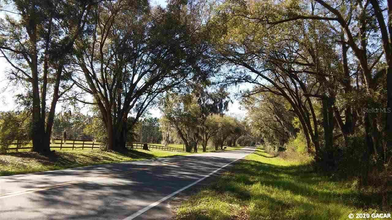 This is such a pretty five acres. It fronts with board fencing along one of the most scenic roads in the area. Beautiful, tree-lined Elim Church Road leads to the main entrance and the head springs of Ichetucknee River State Park. There is a mix of pines and oaks and other native trees, with scattered clearings throughout. The pines could be future income, or you can just make a winding drive into the middle and one of the private, lovely clearings. Horses are allowed. The property is in a great location, with easy access to Gainesville, Lake City, and I-75. Seller will consider owner financing with a good down payment and 5 year balloon. Open Builder.