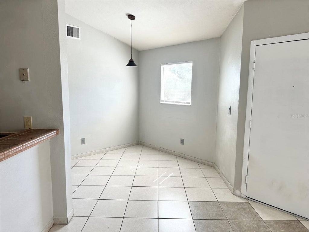 Photo of 2524 Woodgate Boulevard #201, Orlando, FL 32822 (MLS # O6440652)