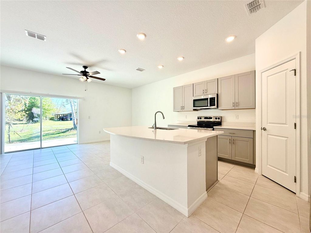 Photo of 348 River Front Way, Edgewater, FL 32141 (MLS # O6394309)