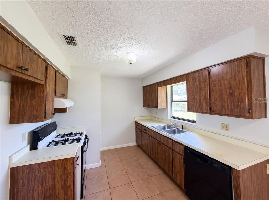 Photo of 207 NE 3rd Terrace, Williston, FL 32696 (MLS # O6402452)
