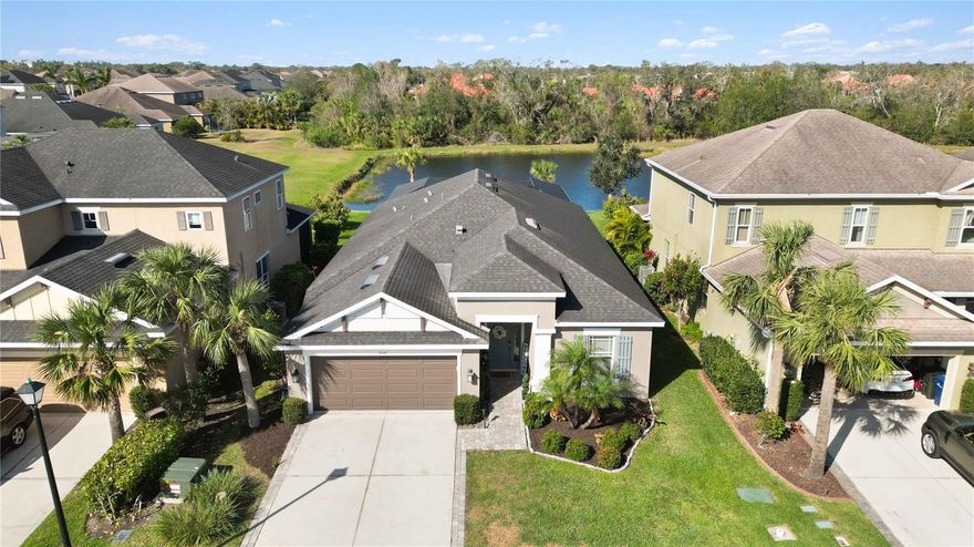 Amazing Deal Alert!!! Welcome to this FURNISHED (optional) and meticulously maintained Pinehurst III Model with a custom SALTWATER POOL and stunning LAKE VIEWS. Situated in the highly sought after Arbor Lakes community! This exquisite home exudes elegance from the moment you arrive with beautiful landscaping, an extended driveway, pavers walkway, and an 8-ft door that opens to this bright and spacious home. Featuring high ceilings, 3 bedrooms plus a Den/Office, 2 bathrooms, and many impressive upgrades. Just off the foyer you will find double doors leading to the den that can be used as an office/playroom/media room which includes a built-in desk with ample storage and a custom murphy bed. The kitchen provides newer stainless-steel appliances, updated 42-inch cabinets, quartz counters, a natural gas stove, a pantry, and an eat-in dining area. Retreat to the spacious master bedroom that is highlighted with a gorgeous custom feature wall, large his and hers walk-in closets, and a private en-suite bathroom with double vanities, a garden tub, and a large walk-in shower with a frameless glass enclosure. This home was freshly painted inside and out and also comes with updated lighting, fans, in-wall pest control system, reclaimed water sprinkler system, shelving in the garage and much more. Step outside into your private OASIS! Your eyes will immediately be drawn to the gorgeous custom saltwater pool with added water features, a sundeck, lighting, and gas pool heater. Relax outside on the extended patio overlooking the beautiful lake and amazing sunsets. Surround sound outdoors and TV hook-ups are provided for added entertainment. The built-in outdoor cooking area is equipped with granite countertops and a Blacktone Griddle & Air Frier. This impressive home shows like a model!!! Located in one of the most sought-after communities in Palmer Ranch with A-rated schools, No CDD fee, 8 Miles east of Siesta Key Beach, 1 mile to the Legacy Trail, shopping and restaurants nearby. Arbor Lakes offers a wide variety of activities including a basketball court, beach volleyball, a resort style community pool, a hot tub, pavilion with grills, a splash park, fire pit, playground, sidewalks throughout, and a dog park. Come enjoy all that Arbor Lakes has to offer!!