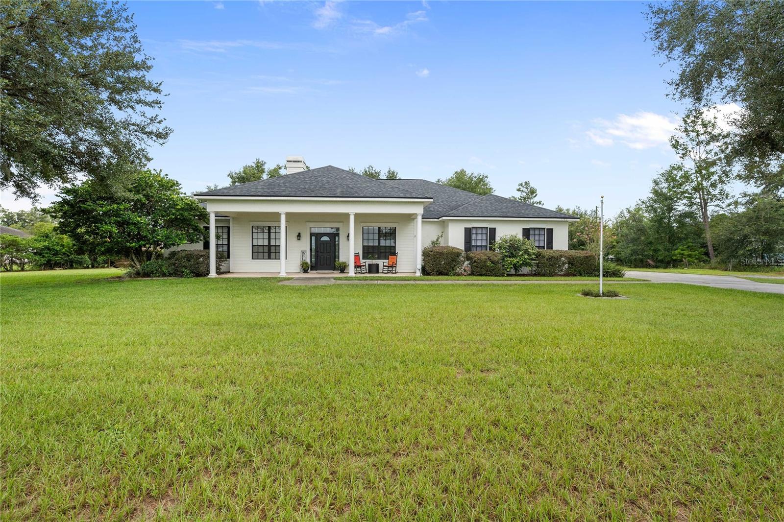 This stunning 4-bedroom, 3-bathroom home offers over 3,100 sq. ft. of beautifully designed living space on a full acre—blending comfort, elegance, and functionality, all with NO HOA!
Step inside to soaring ceilings and a spacious great room with a built-in entertainment center, perfect for family gatherings. The gourmet kitchen is a chef’s dream, featuring granite countertops, a center island with sink, ample cabinetry, and appliances replaced in 2024. A bright eat-in area and formal dining room provide plenty of options for everyday meals and special occasions.
The generous owner’s suite boasts dual walk-in closets and a luxurious en suite with dual sinks, soaking tub, and walk-in shower. A split floor plan ensures privacy, with a guest wing offering three oversized bedrooms with huge closets. Two fully renovated bathrooms (2024) add modern style and convenience—one with direct bedroom access, the other opening to the lanai.
A large home office with fireplace and built-in shelving overlooks gorgeous front views—ideal for working remotely. Outdoors, enjoy a welcoming front porch, an expansive screened lanai with bar and sliders that open fully for breezes, plus a backyard oasis. Entertain under the covered pavilion (2023), complete with built-in stone cooking area, firepit, and storage shed. A mosquito sprayer system (2019) keeps outdoor spaces enjoyable year-round.
Peace of mind upgrades include a Generac whole-home generator system, owned solar panels with warranty (2019), a newer roof (2021), Termite prevention (2024), a new well pump (2025), a water softener (2025), 3-car garage with updated epoxy flooring (2023), washer & dryer included.
The property is fully fenced and pet-ready, making it the perfect blend of indoor comfort and outdoor living.
Don’t miss the opportunity to own this exceptional home—style, functionality, and modern upgrades all in one!