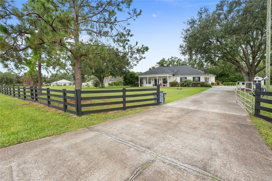 This stunning 4-bedroom, 3-bathroom home offers over 3,100 sq. ft. of beautifully designed living space on a full acre—blending comfort, elegance, and functionality, all with NO HOA!
Step inside to soaring ceilings and a spacious great room with a built-in entertainment center, perfect for family gatherings. The gourmet kitchen is a chef’s dream, featuring granite countertops, a center island with sink, ample cabinetry, and appliances replaced in 2024. A bright eat-in area and formal dining room provide plenty of options for everyday meals and special occasions.
The generous owner’s suite boasts dual walk-in closets and a luxurious en suite with dual sinks, soaking tub, and walk-in shower. A split floor plan ensures privacy, with a guest wing offering three oversized bedrooms with huge closets. Two fully renovated bathrooms (2024) add modern style and convenience—one with direct bedroom access, the other opening to the lanai.
A large home office with fireplace and built-in shelving overlooks gorgeous front views—ideal for working remotely. Outdoors, enjoy a welcoming front porch, an expansive screened lanai with bar and sliders that open fully for breezes, plus a backyard oasis. Entertain under the covered pavilion (2023), complete with built-in stone cooking area, firepit, and storage shed. A mosquito sprayer system (2019) keeps outdoor spaces enjoyable year-round.
Peace of mind upgrades include a Generac whole-home generator system, owned solar panels with warranty (2019), a newer roof (2021), Termite prevention (2024), a new well pump (2025), a water softener (2025), 3-car garage with updated epoxy flooring (2023), washer & dryer included.
The property is fully fenced and pet-ready, making it the perfect blend of indoor comfort and outdoor living.
Don’t miss the opportunity to own this exceptional home—style, functionality, and modern upgrades all in one!