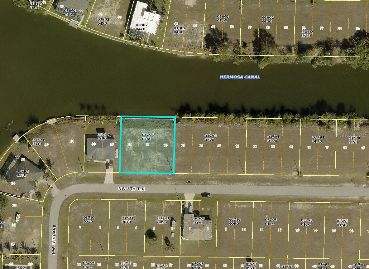 Prime Canal/Lakefront Lot in Cape Coral – Cleared and Ready to Build! This oversized, cleared lot is ready for your dream home and offers north rear exposure on the Hermosa Canal and Albatross Lake, featuring 120 feet of cement seawall—perfect for boating, fishing, or simply enjoying the water views. Enjoy quick access to Burnt Store Road, Coral Oaks Golf Course, and the future Seven Islands project. Nearby you'll also find Mariner High School, Mariner Middle School, and the NW Regional Library, making it a convenient location for everyday amenities and family-friendly living. With ample space to design and build, this lot presents a rare opportunity to create your dream home with panoramic water views and a private, serene setting. A great spot to create your piece of the Cape Coral lifestyle—don’t miss your chance to turn this cleared, ready-to-build property into your personal paradise!