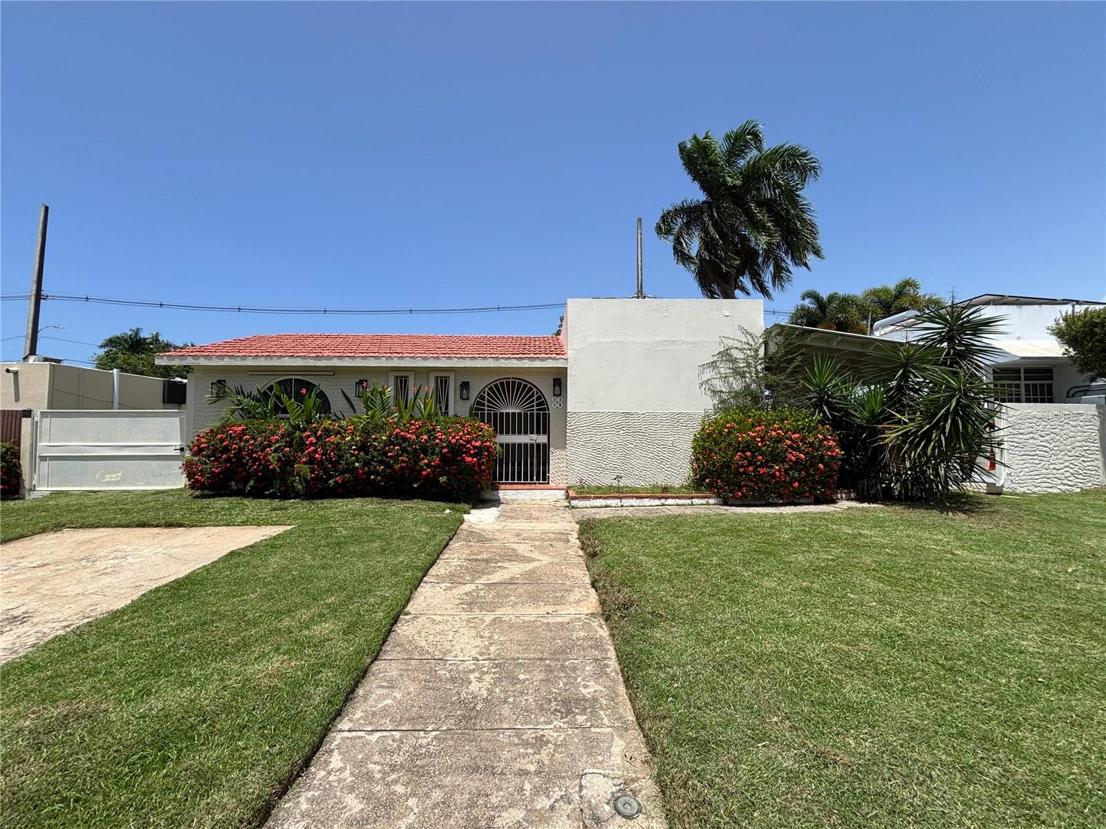 Located in the sought-after Dorado del Mar community, this beautifully renovated residence offers the perfect blend of comfort, functionality, and convenience. The home features three spacious bedrooms and two full bathrooms, complemented by a bright and open living and dining area ideal for both everyday living and entertaining. The fully equipped modern kitchen is ready for immediate use, making meal prep seamless and enjoyable.
Thoughtfully updated throughout, the property includes air conditioning in every room and runs entirely on solar energy (tenants are only responsible for any excess electricity usage). It is offered semi-furnished, with the option to be fully furnished upon request for an additional charge, making it move-in ready for a variety of living needs. Pets are welcome, making this home a great fit for animal lovers seeking a comfortable and accommodating space.
Residents of Dorado del Mar enjoy access to community amenities such as a sports court, playground, landscaped green areas, and 24/7 gated security. The neighborhood is family-friendly and well-maintained, just minutes away from the beach, local dining, golf courses, and everyday conveniences. This is an ideal rental opportunity for those seeking comfort and lifestyle in one of Dorado’s most established and vibrant communities.