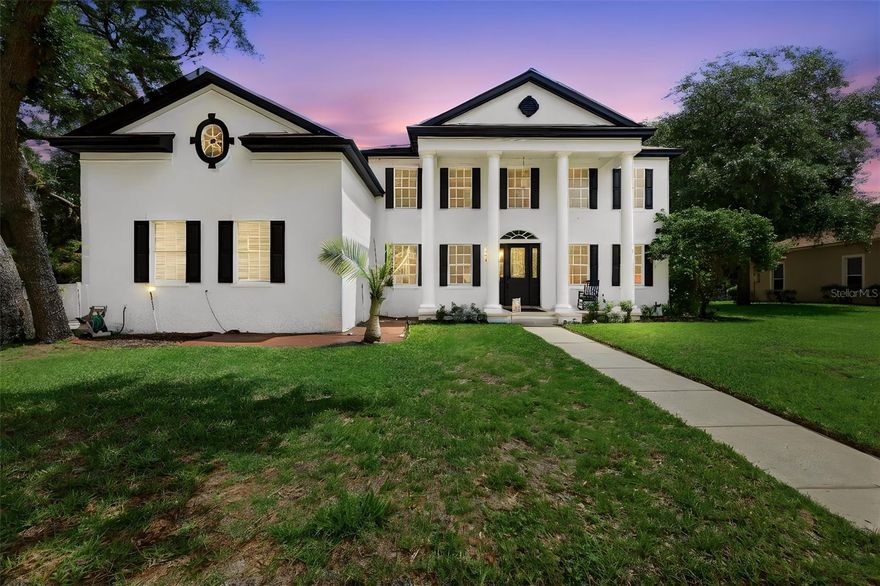 Welcome to this stunning 5-bedroom, 4-bathroom Colonial-style pool home located in the highly sought-after gated community of Ashley Cove. This exceptional residence blends timeless elegance with modern upgrades, offering a truly one-of-a-kind living experience.

From the moment you enter, you’re greeted by a grand spiral staircase and soaring high ceilings, complemented by rich hardwood flooring and exquisite, high-value chandeliers that add character and sophistication throughout the home. The spacious living room features a cozy fireplace, while large windows flood the home with natural light, highlighting the generous room sizes and thoughtful layout.

The ground floor boasts a luxurious primary suite with two walk-in closets, a beautifully updated modern bathroom, complete with dual sinks, a large walk-in shower, and a relaxing soaking tub. The kitchen is both stylish and functional, featuring granite countertops, hardwood cabinetry, and stainless steel appliances including a range, microwave, dishwasher, and refrigerator. A renovated laundry room is also conveniently located on the main level.

Upstairs, enjoy a unique movie theater room with a private balcony overlooking the expansive property and an additional bonus room!

Situated on an oversized, fully fenced lot with no rear neighbors, the outdoor space offers privacy and tranquility. The screened-in pool and spa include a child safety net, creating the perfect setting for year-round enjoyment. Major updates include new pool tiles and pool re-surfacing in 2025. The property is surrounded by eight beautiful oak trees, three of which were recently removed in 2026 for hurricane safety.

Additional features include a 3-car garage and numerous updates: new pool pump (2023), pool re-surfaced (2025), roof replacement (2019), updated A/C units (2018 & 2021), electrical updates (2025), new hot water heater (2026), and fresh interior paint (2025).

Conveniently located near Lake Tohopekaliga, with easy access to the Florida Turnpike, and just minutes from Kissimmee, NeoCity, major attractions, shopping, and dining this home truly has it all. Schedule your showing today!