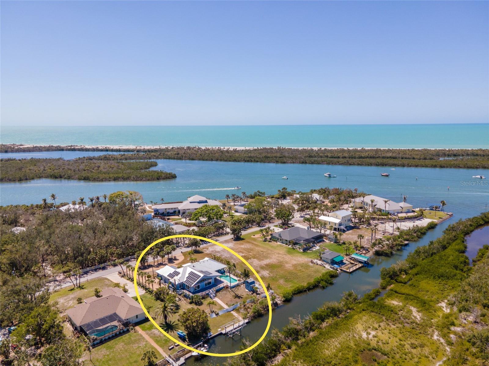 You’ve earned this. Nestled in the heart of Cape Haze and ONLY 4 MILES from the legendary beaches of BOCA GRANDE, this coastal waterfront estate is your personal slice of paradise. Whether you're casting off from your PRIVATE DOCK with 6,000 LB BOAT LIFT or exploring nearby island hideaways, life here is a permanent vacation. With NO BRIDGES TO THE GULF, LESS THAN 150 YARDS FROM OPEN WATER!
***Inside, the magic continues with 3,500+ square feet of timeless design and effortless elegance. Guests are greeted by travertine tile floors, soaring ceilings, and inviting spaces to relax or entertain. A cozy front sitting room doubles as a den, library, or office, perfect for quiet mornings or lively conversations. At the heart of the home, the open-concept living area shines with WALL-TO-WALL SLIDERS and transom windows, bathing every corner in natural light. The built-in entertainment center anchors the space, and the nearby chef’s kitchen is ready to impress with GRANITE COUNTERTOPS, double ovens, a Sub-Zero fridge, walk-in pantry, and dry bar with wine fridge. Enjoy casual breakfasts at the bar, sunny brunches in the dinette, or elegant dinners in the formal dining room—framed by panoramic views of your private pool and the preserve beyond.
~~~Your primary suite is a true retreat behind French doors. With a sitting area, pool access, and a decorative fireplace, it offers comfort and style. The spa-inspired en suite features a jetted soaking tub, walk-in shower, dual vanities, private lavatory, and a massive custom closet with dressing space. Hosting overnight guests? They’ll love the two additional bedrooms joined by a Jack-and-Jill bath, as well as a flexible fourth room ideal for a home office, gym, or creative studio. A pool-accessible guest bath and a well-appointed laundry room add function to luxury.
***Step outside to your private resort. The screened lanai, HEATED POOL AND SPA, and multiple covered seating areas invite you to entertain, dine, and unwind. All of this backs up to the tranquil beauty of Don Pedro State Park Preserve—no rear neighbors, just nature. And when adventure calls? Your boat is waiting. Cruise down the canal to Lemon Bay and the Gulf of Mexico—no bridges, no hassles, just open water.
~~~Cape Haze offers the perfect blend of seclusion and access, with nearby golf, shopping, dining, and outdoor adventures.
***Schedule your private showing today and experience the coastal dream for yourself—before someone else does.