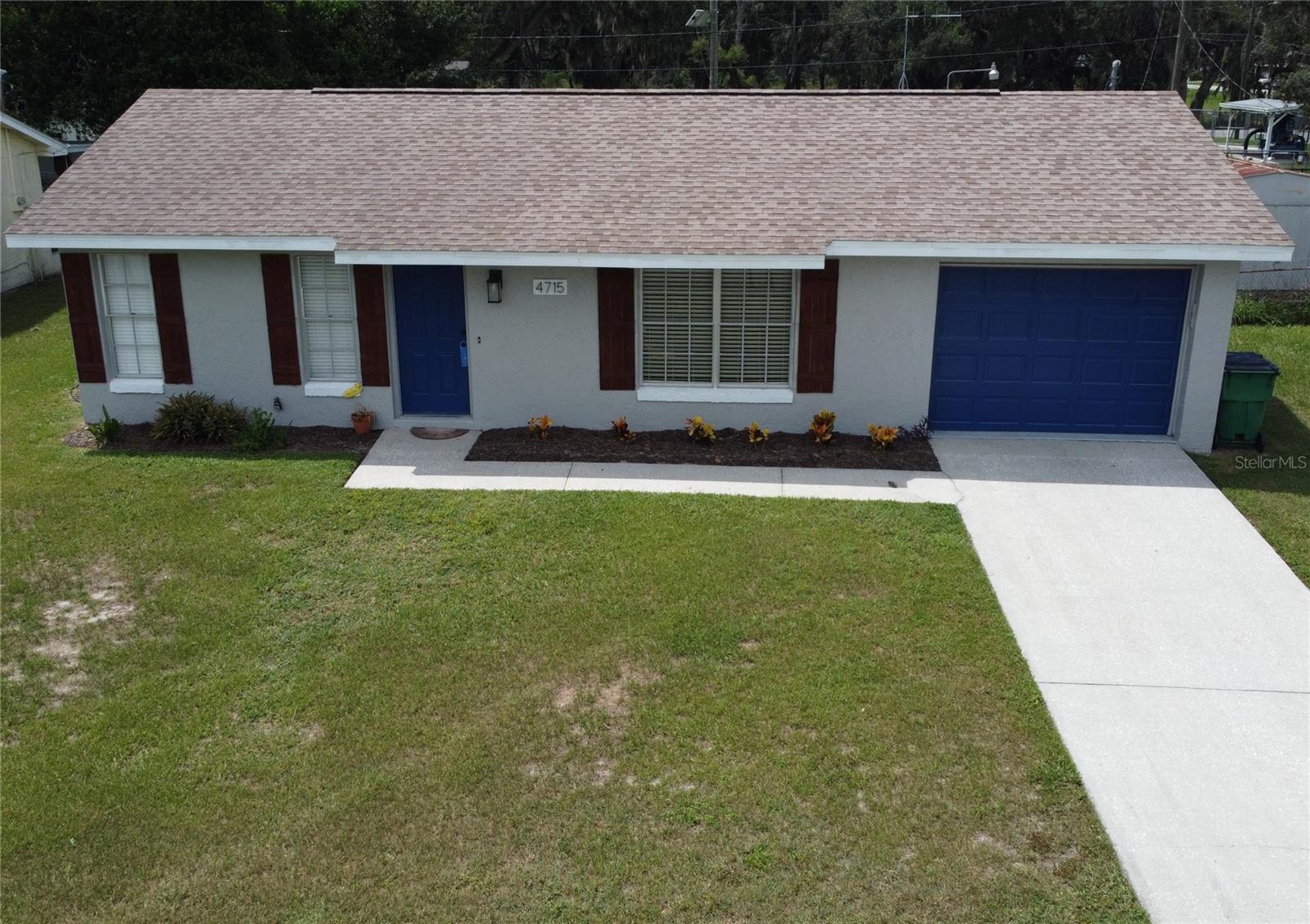 This home will not disappoint. Well maintained home with split bedroom plan. Freshly painted inside & outside. Roof is 4 years old. Spacious home that has everything you could want at an affordable price. Living area boasts upgraded lighting and custom accent wall. Upgraded lighting and vanity & shower head in the bathroom. Good sized bedrooms with new flooring and ceiling fans. Larger kitchen than most for this size home. Nicely landscaped with yard space and even has a garage! Close to Zephyrhills park and downtown Zephyrhills yet still close to Wesley Chapel. This is a must see!