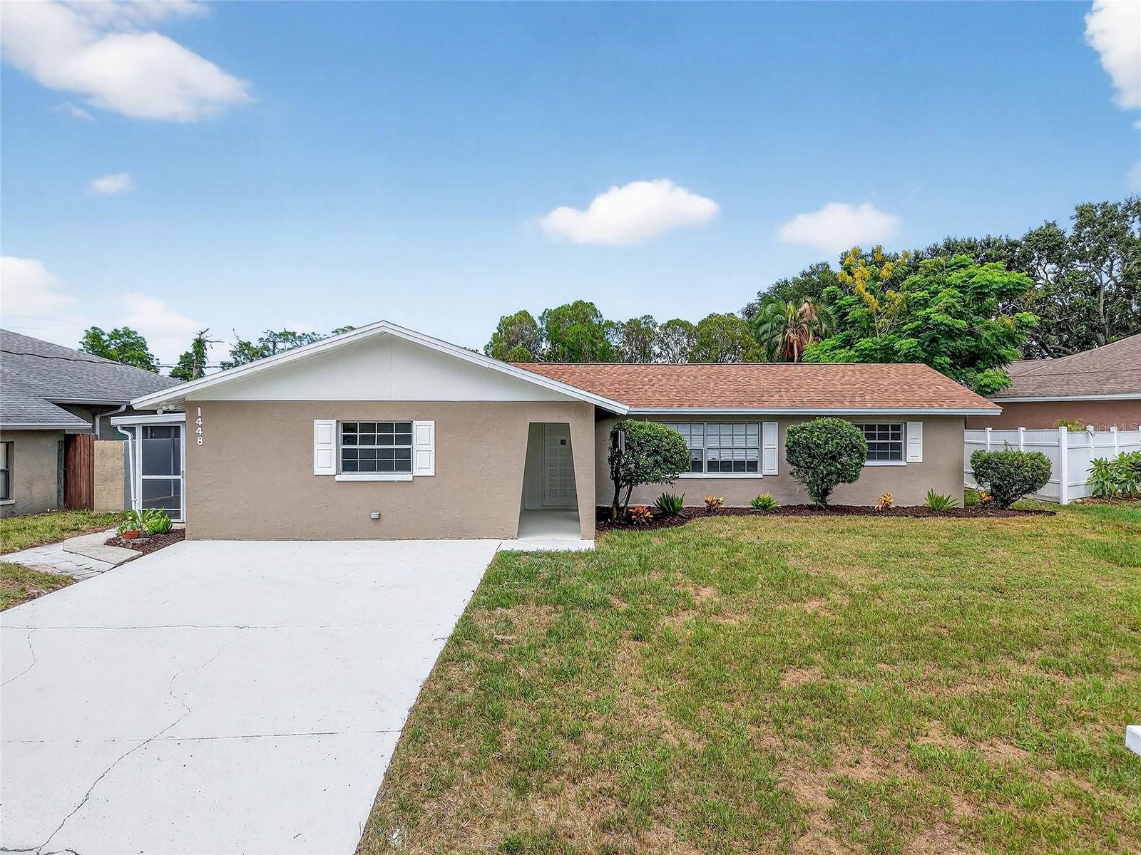 One or more photo(s) has been virtually staged. Welcome to this beautifully updated 4-bedroom, 3-bathroom home offering over 2,300 sq. ft. of living space plus a private mother-in-law suite. With a brand-new 2025 roof, 2025 water heater, and refreshed AC system with all-new ductwork and vents, this home is move-in ready! Step inside to find a light, bright, and modern interior with new wood-look luxury vinyl flooring throughout. The spacious living room features an electric fireplace, while the brand-new kitchen shines with new cabinets, quartz countertops, stainless steel appliances, a deep sink, and an open layout to the family room, perfect for entertaining. The primary suite includes a ceiling fan, large walk-in closet, private office/den, and a spa-like bathroom with a gorgeous tiled shower with a rain showerhead and glass enclosure, new vanity, and designer finishes. Additional bedrooms are nicely sized and share a fully updated bathroom with modern touches. The mother-in-law suite has its own private entrance from the screened side porch, complete with a new bathroom and glass-enclosed shower, ideal for extended family or guests. Enjoy Florida living outdoors with a screened back lanai, fenced backyard, and plenty of space for grilling, gardening, or soaking up the sunshine. All this in an unbeatable location just blocks from Lake Tarpon, where you can enjoy boating, fishing, and lakefront activities. Close to shopping, dining, Publix, A.L. Anderson Park, and with easy access to US-19 and Keystone Rd for convenient travel. Schedule your tour today!