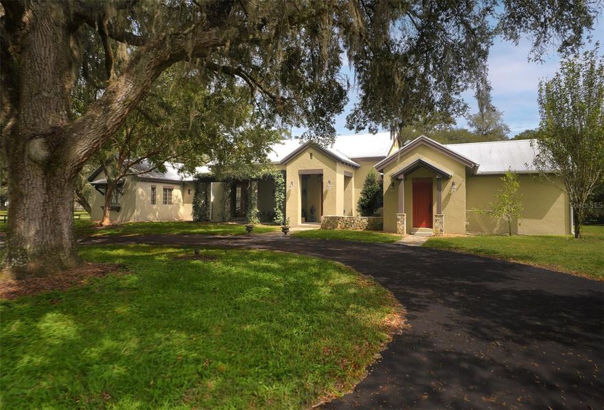 This fantastic 20 acre farm is home to some of the most beautiful pastures, landscapes, and granddaddy oaks in the area. It's 3-boardfenced, and less than 15 minutes to the renowned World Equestrian Center and Golden Ocala Country Club, and less than 3 miles to HITS showgrounds. The custom home features special design elements and master craftsmanship throughout, including wood-beamed ceilings, travertine flooring, spectacular island kitchen with new Thermador appliances and Subzero refrigerator, and a spectacular en suite master bedroom retreat. The master BR has its own patio just outside the double doors; step outside and enjoy the sounds of the birds, and the views of your private and serene paradise. A lovely sunroom has recently been added off the kitchen, providing a wonderful spot to relax and enjoy the outdoor views from the comfort of your home. The barn features 5 stalls, tongue and groove, ceiling fans, flyspray sytem, washrack with hot/cold water, a/c tack room w/washer, dryer, bathroom, and kitchenette. A new septic system has been installed to supply the barn and nearby RV hookup.  There are 2 pole barns supplying plenty of room for equipment storage. The farm also provides a 20x60 meter all-weather Longwood arena with ggt footing, sprinklers, and mirrors; there is also a round pen. Also included is an adorable 3 BR/2 BA guest home built with the same quality and standards of the main home; it has new washer and dryer, and new a/c. It's perfect for guests, mother-in-law quarters, or a tenant. A generator provides power to the cottage and barn in those rare cases of a power outage. This farm has it all, is perfect for any discipline, and is completely ready for you and your horses to move in.  Additional acreage is available.
