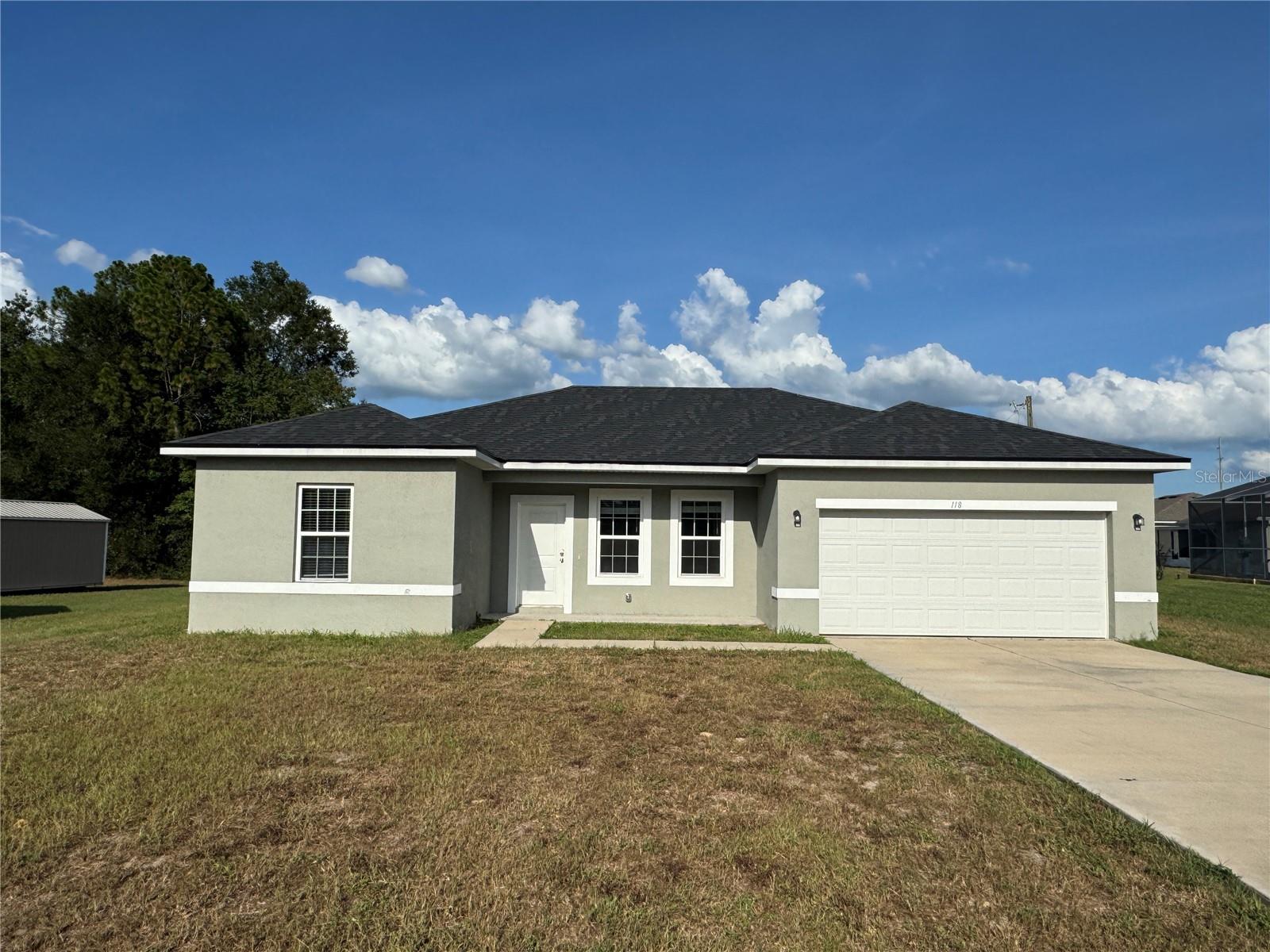 PRICED TO SELL.....Welcome to this beautiful modern 4-bed/2-bath home in the desirable SW Ocala neighborhood with a lot of upgrades. The house features ceramic tile flooring throughout the home. Custom Home offers open floor plan with spacious family room, dining room and kitchen combination. Kitchen has beautiful quality cabinets including a center island/breakfast bar, granite counters, upgraded soft-close cabinets, Stainless steel appliances, & pantry. Bedrooms are spacious with large closets for storage. Split floor plan. Master bedroom suite has oversized walk-in closet, dual sinks/granite counter, upgraded cabinets, walk-in shower w/ceramic tile. Guest bath has granite counter/upgraded cabinet w/ shower/tub combo. 2 car garage w/opener. The yard is large enough to install a pool if you so desire. Blinds accent the windows. Large laundry room. Concrete block w/stucco construction. Convenient location to shopping, dining, parks, library, golf, & I-75. We'd love to show you this home. I'm sure you'll love it.