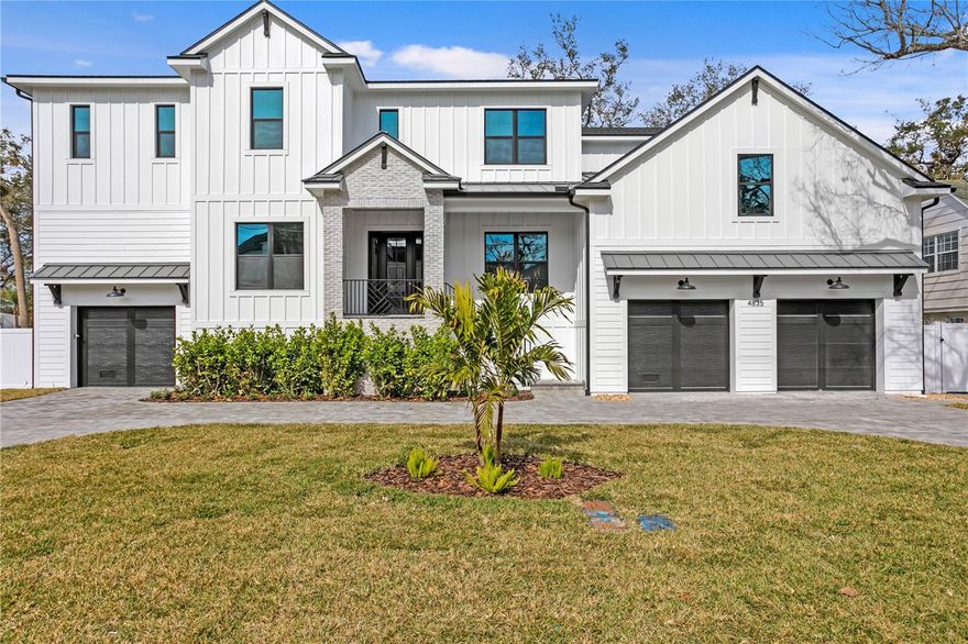 TB Homes Modern Farmhouse, JUST COMPLETED! The stately home spans over a 100x100 lot, BUILT UP in beautiful Sunset Park! 2 story block construction, Impact rated windows & sprayfoam insulation. 3 car garage, Circular Driveway, Covered lanai with heated/saltwater pool & outdoor kitchen. As you enter the foyer you have a classic layout w/a formal dining room to one side & an office to the other  Great room w/coffered ceiling and charming marble adorned fireplace is open to the Kitchen (Professional Series Sub-Zero Wolf appliances, quartz counters/matching quartz backsplash, custom cabinets stacked to ceiling, pot-filler & Kohler farm sink) w/a sunny breakfast nook overlooking the back yard. Behind the kitchen sits the perfect playroom off of the mud-room (custom cabinetry) w/a powder bath nearby. Topping off the 1st level is a guest suite/full bathroom. The 2nd floor holds 3 additional ensuite bedroom/bathrooms w/designer bath tiles, large laundry w/cabinetry/sink, a gym, a  media room equipped w/a kitchenette (micro + fridge) & it's own private 1/2 bath and an expansive primary suite. Upgrades include: Smooth Drywall, RH Lighting, Solid Core Doors & Custom Oak Staircase. Mabry, Coleman, Plant school district. Renderings are for artistic purposes only. Please refer to spec sheet for accuracy.