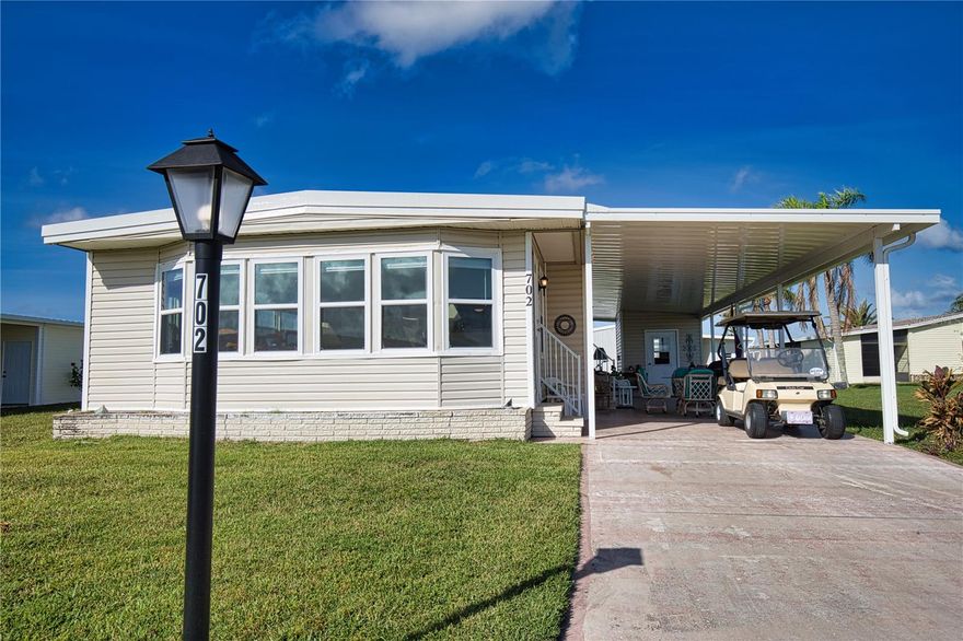 This charming 2-bed, 2-bath home is your chance to grab a piece of paradise in this vibrant 55+ community.  The kitchen/dining room combination is perfect for dinner parties, while the living room/family room combo is ideal for entertaining friends or enjoying fun family game nights!  There are new (2024) double-pane, single-hung windows throughout the home, with a wall of windows in the family room for bringing in lots of natural light.  The primary bedroom and ensuite bathroom are spacious, with a walk-in closet, and the guest bedroom and bath will make all your guests feel like they'll never want to leave.  The new carport brings you to a utility room with a washer, dryer, deep sink, workbench, and storage. A new roof with a transferable warranty was installed in 2024.  This lovely home offers carpet in the living room, family room, and bedrooms.  The home is being offered turnkey, and as a bonus, a golf cart is included.  This is the perfect home to make your Florida dreams come true!  Welcome to La Casa, an enchanting community where 974 home sites are beautifully set among native trees, surrounded by spacious common areas and eight serene lakes. La Casa is conveniently located between Sarasota and Fort Myers. Enjoy easy access to shopping, sightseeing, golfing, and fishing, all while immersing yourself in the rich culture of Southwest Florida.  Experience the warmth of Southwest Florida’s winters in a relaxed environment, far from the east coast hustle. Our lush, mature landscaping reflects the dedicated care of residents and management. Come visit our charming oasis and discover why La Casa is the ultimate destination for snowbirds and year-round residents!