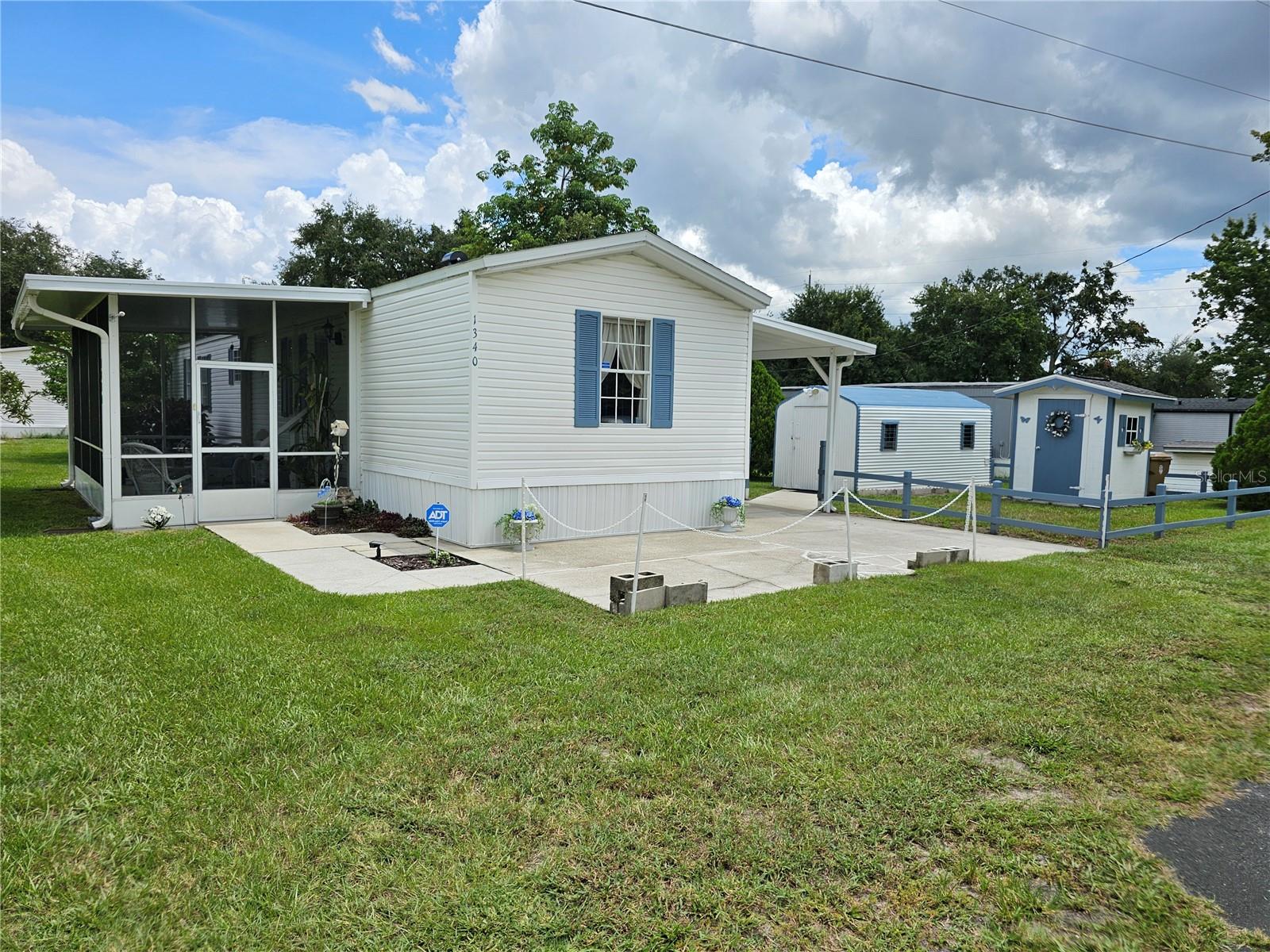 RARE FIND! Fully furnished, move in or income ready, Perfect for full-time living or Florida Snowbirds with Great potential as Airbnb income property. You own the land, No HOA, No Deed restrictions, New Roof, Large Corner Lot, Beautifully cared for & landscaped for privacy. Pet & smoke free home, very Clean 2b/2ba, Privacy-split bedroom floor plan, with spacious 924 SF, Large Workshop Storage shed & Gardening shed. Back Porch has maintenance free Composite Decking, Railings, Where you can enjoy sunrises & sunsets that light up the sky in array of colors or just relax overlooking the serene backyard garden area & take in the fragrant plants while watching the hummingbirds feed on honeysuckle. Gated yard for RV or boat storage. Indoor is spacious & lots of natural light coming in the charming French windows with lots of privacy from the carefully thought out outdoor landscaping. Close to everything! Orlando area attractions, shopping, Restaurants, Turnpike, Sunrail, Airports, Beachline