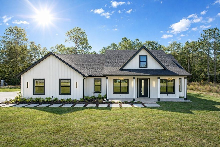 Built by Halona Development Group, this beautifully crafted residence offers an exceptional blend of comfort, quality, and thoughtful design, set in a peaceful area. 
This spacious home features 4 well-appointed bedrooms, including a generous primary suite, along with 3.5 modern bathrooms. With approximately 2,519 sq ft of living area, the interior provides an inviting layout ideal for family gatherings, entertaining, or quiet evenings at home. Every detail reflects careful construction and attention to quality, creating a sense of warmth, durability, and timeless appeal.
The home is further enhanced by premium features, including a Culligan whole-home water treatment system and an automatic 5-zone irrigation system, ensuring both superior water quality inside the home and efficient landscape maintenance throughout the property.
Situated on a generous lot of more than 1.6 acres, the property offers ample outdoor space for recreation, relaxation, or gardening, all surrounded by the tranquil natural setting that defines this area of Ocala. The neighborhood delivers both serenity and convenience, with easy access to everyday essentials, schools, and nearby parks—making it an ideal choice for families and professionals alike.
This home is more than just a residence—it represents a lifestyle of comfort, space, and quality living. Whether hosting memorable moments indoors or enjoying the peaceful outdoor surroundings, this property provides the perfect backdrop for years to come.
Some images have been virtually staged to illustrate the home’s potential.
If the buyer uses the seller’s preferred lender, Complete Mortgage, the seller will cover the buyer’s closing costs.
Don’t miss the opportunity to make this exceptional Ocala property your next home. NO HOA